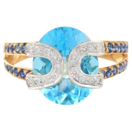For Sale:  Genuine Blue Topaz Cocktail Ring with Sapphire and Diamonds in 18k Yellow Gold