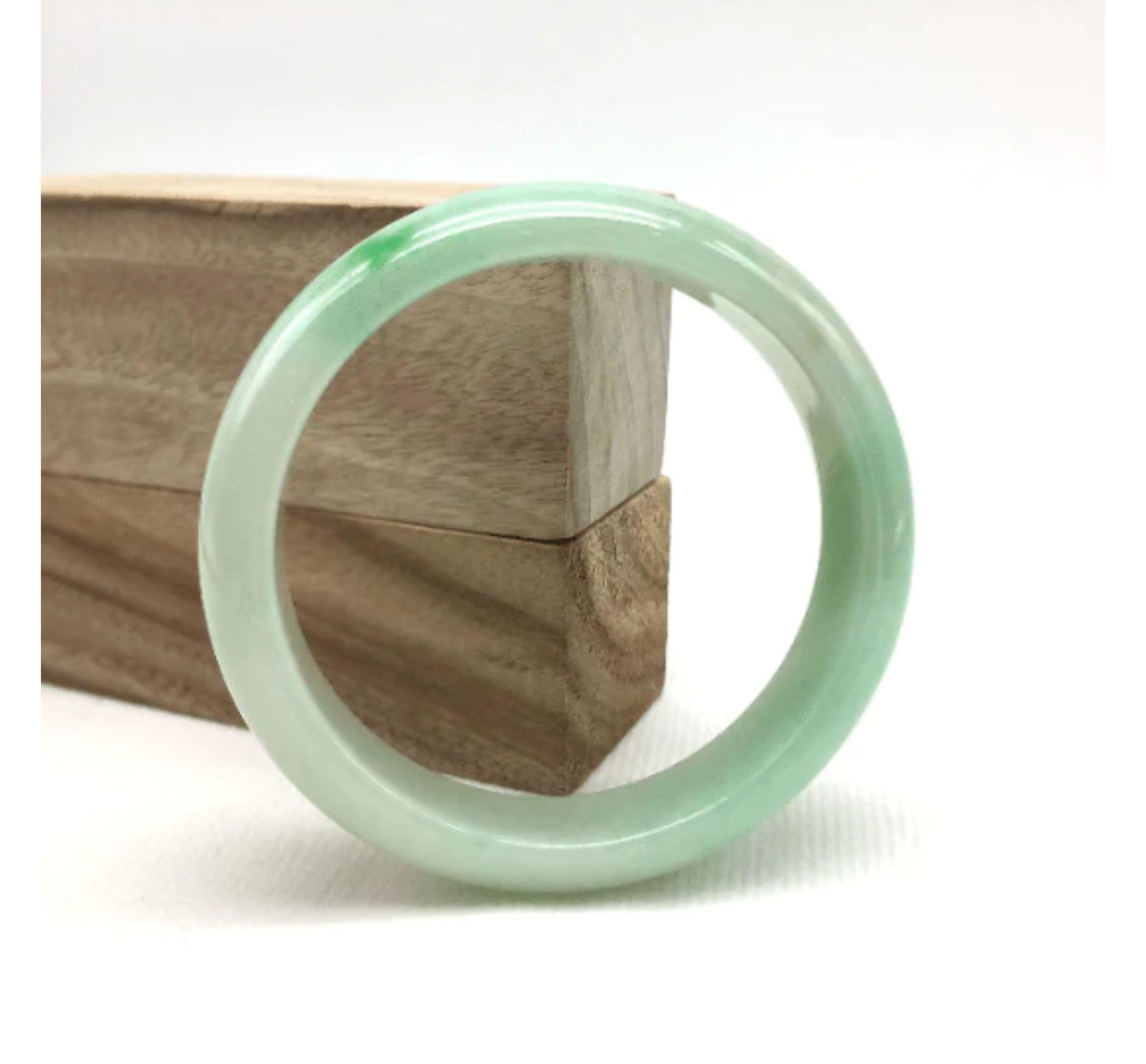 * DETAILS--- This bangle is made with very high-quality smooth jadeite jade, a beautiful green, and lavender color all throughout, and beautiful patterns of green as seen in the pictures. The texture is very smooth and even throughout the bangle,