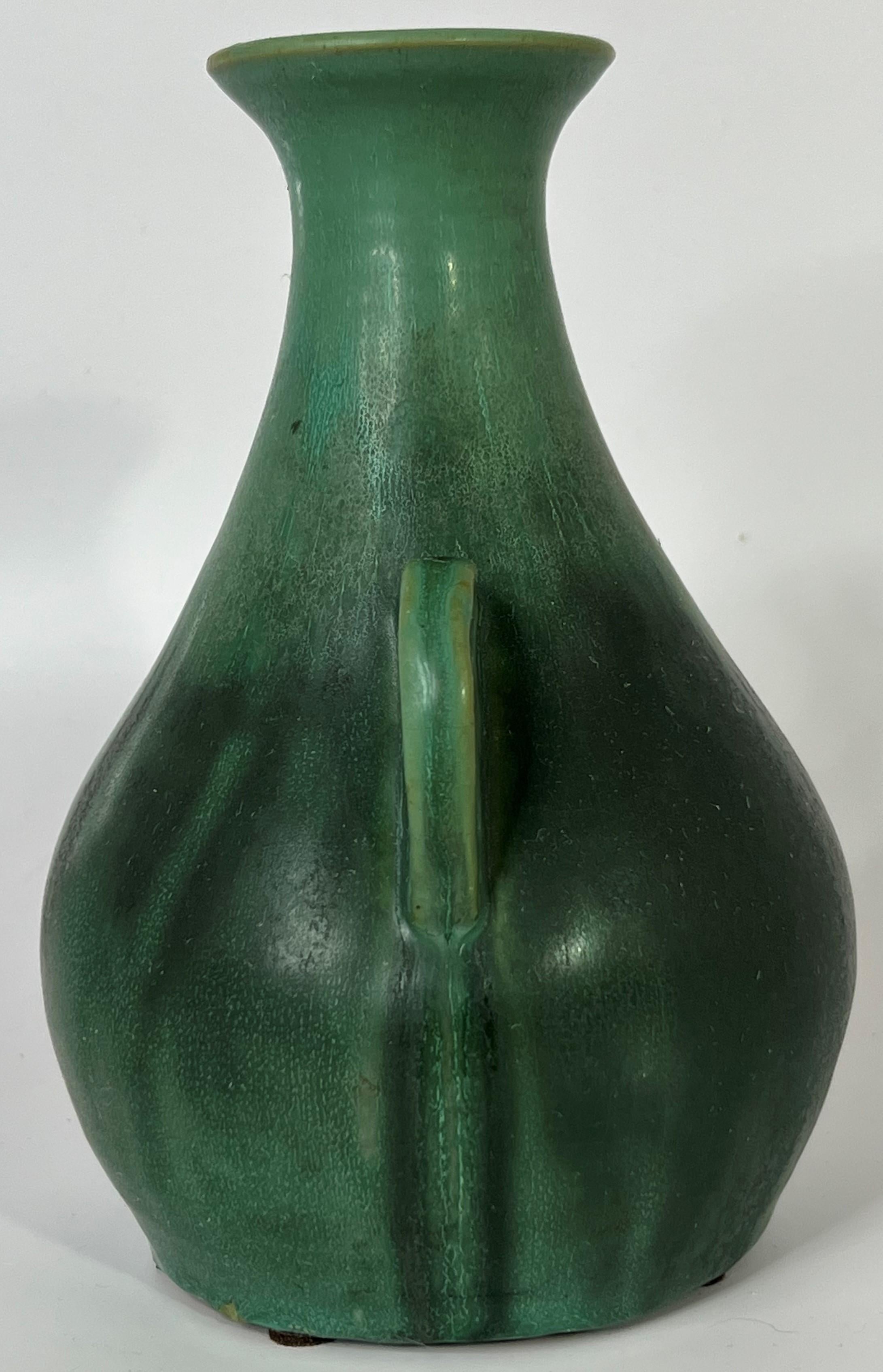 A scarcely seen matte green handled form from the Bybee Pottery in Lexington, KY between 1922-1929.  This example is from the 