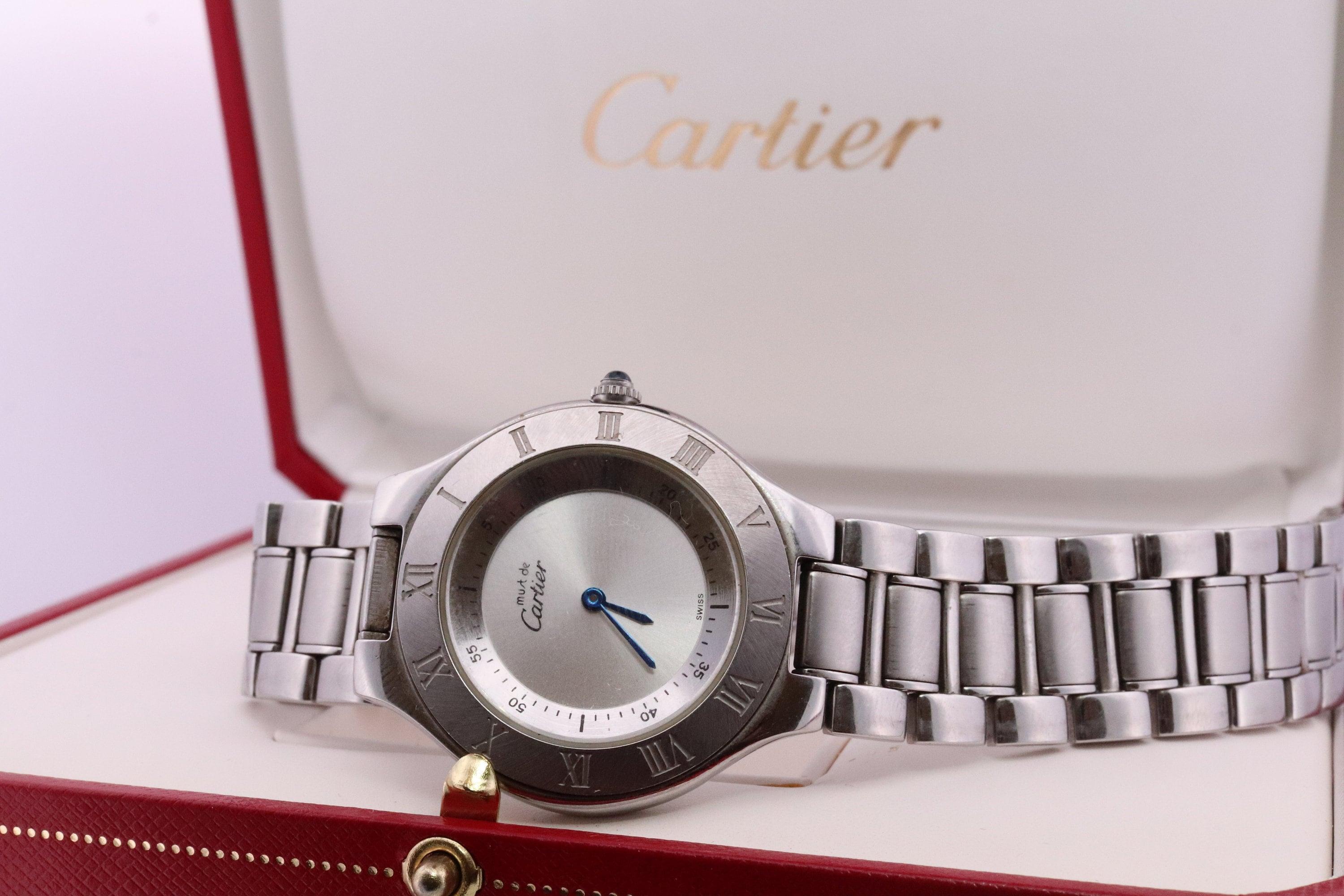 Genuine Cartier watch. Vintage Must de Cartier 21 
1330 Reference number.
Condition: No cracks. Has Scratches around the case. Comes with original Cartier Red box.
New battery installed.
Details:

36mm round Case

New battery installed.
7.5inches