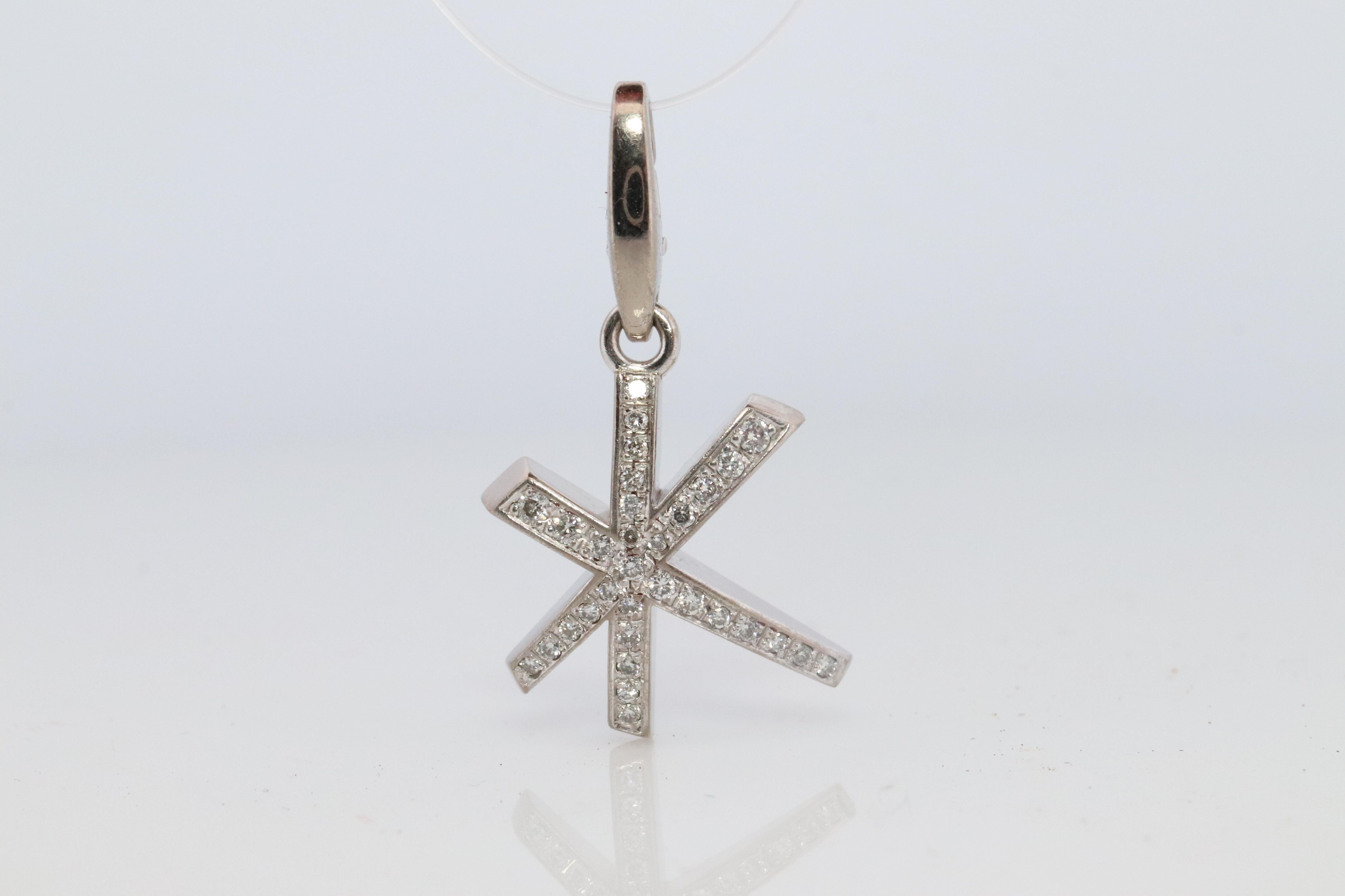 Lovely Find.
PRE-OWNED Authentic Cartier Pendant

Star Firework Diamond Charm.

18k 750 White gold.

15mm by 20mm Dimensions
0.21ctw of Diamonds


4.8grams total