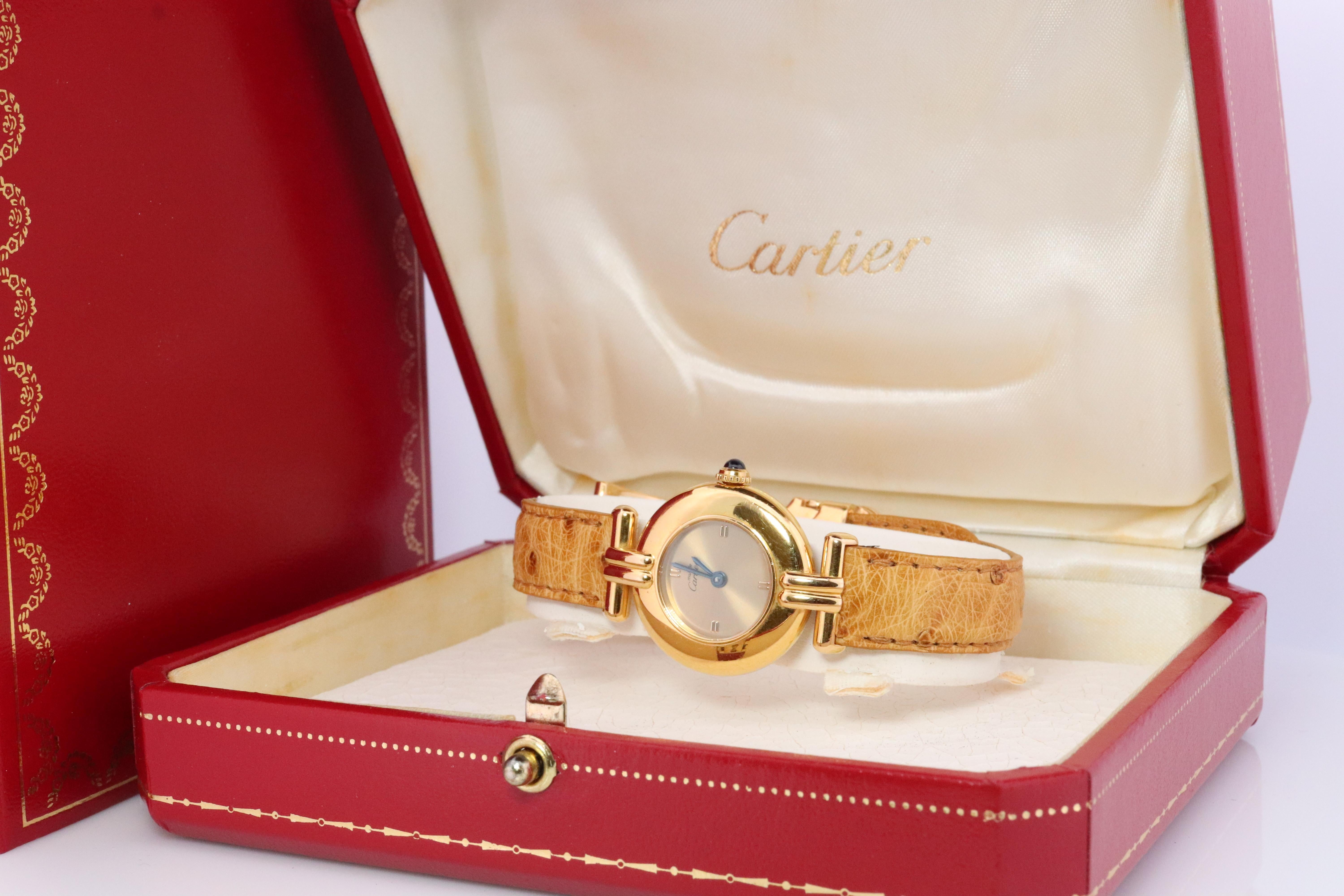 Genuine Cartier watch.

Vintage Must de Cartier Colisee 1902

RARE Gold Face

Condition: Comes with Original case and Paperwork . Several scratches consistent with age and normal wear.

New battery installed.
New Leather High quality strap. Cartier