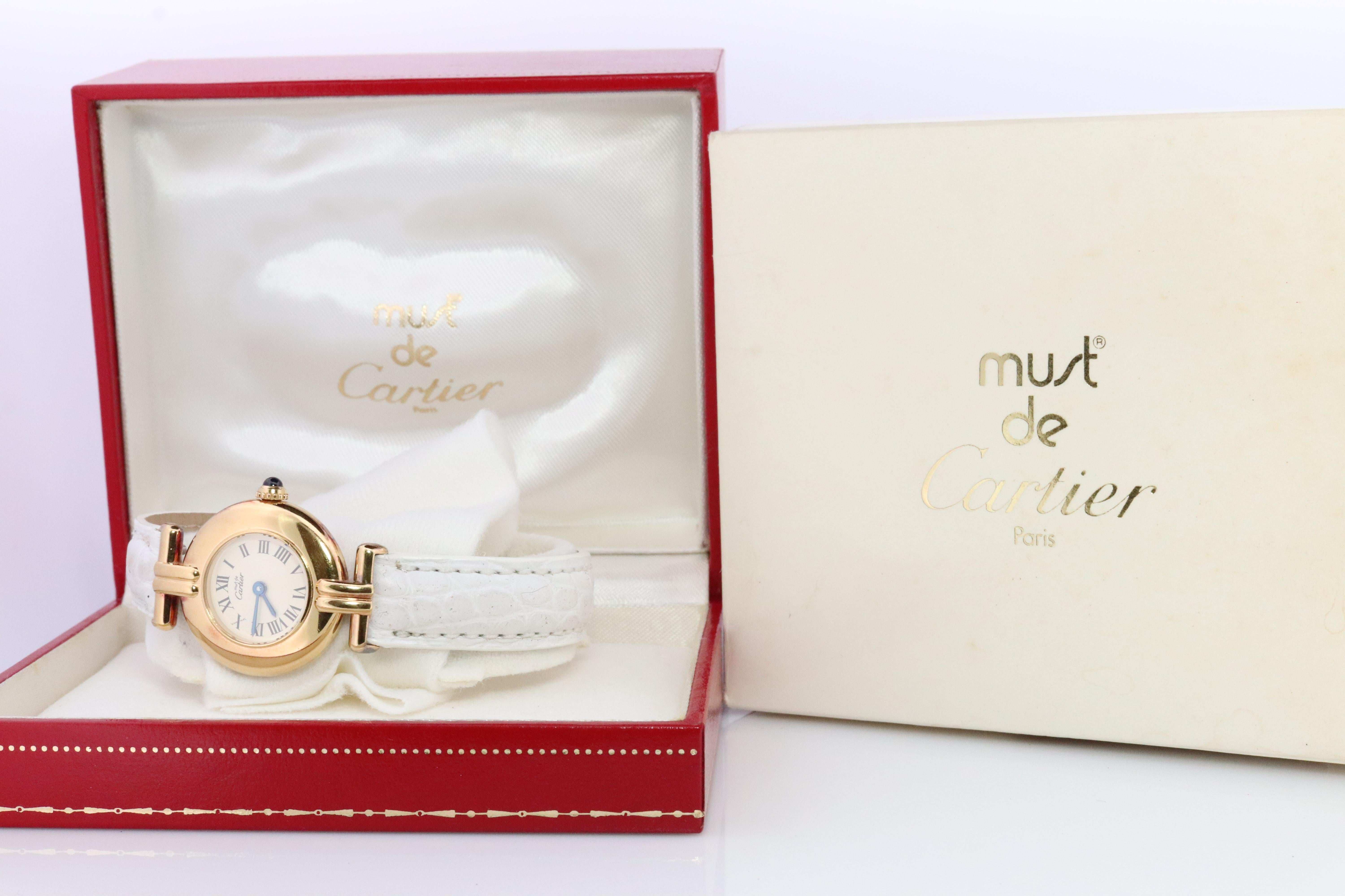 Genuine Cartier watch.

Vintage Must de Cartier Colisee 59002

White Face.

Condition: Comes with Original case and paperwork . Several scratches consistent with age and normal wear.

New battery installed.
New Leather High quality strap. White