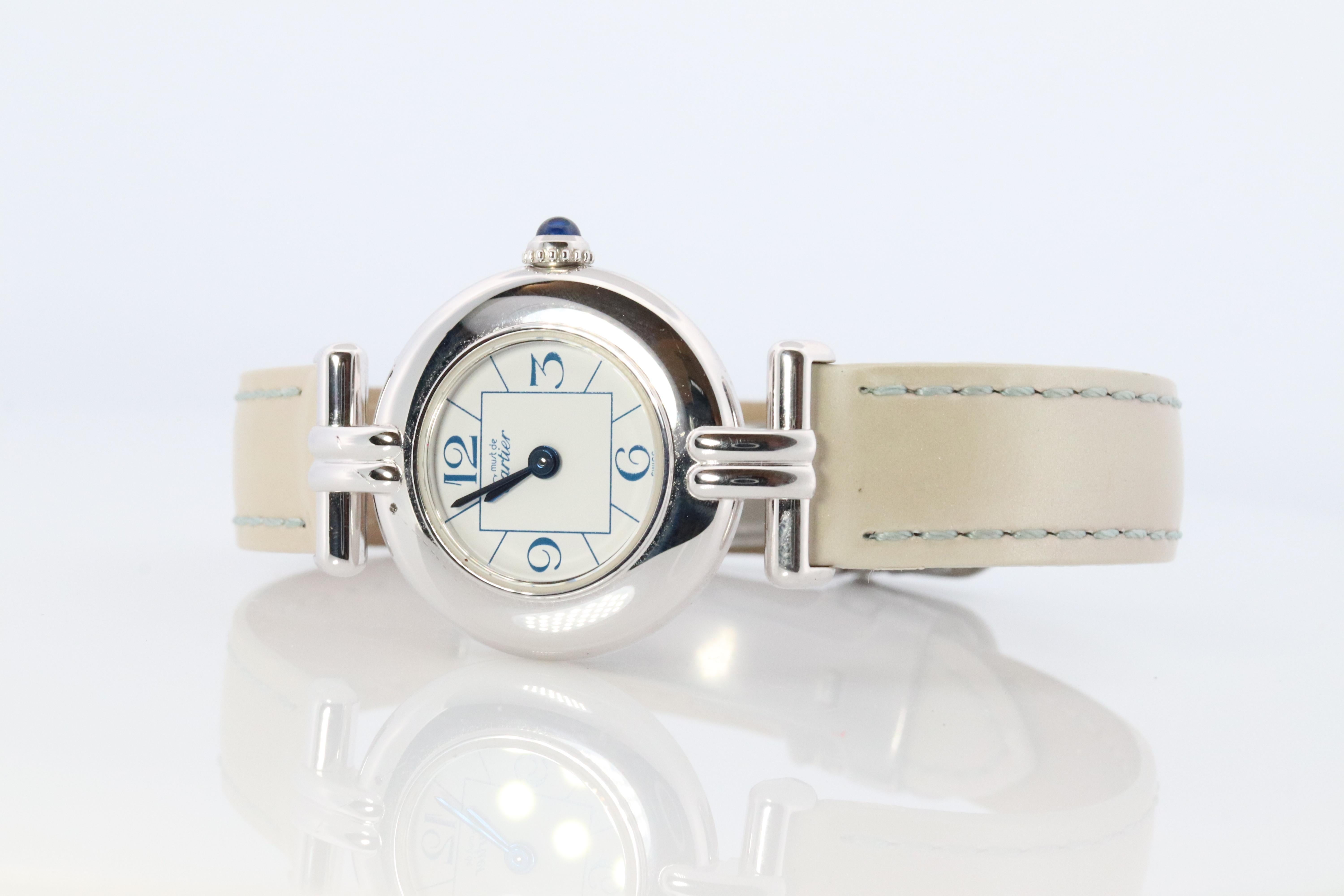 Genuine Cartier watch.

Vintage Must de Cartier Collisee 2411 

RARE White Argent with White dial and blue letter.

Condition: Comes with ORIGiNAL CARTIER case. 

Original Cartier leather band with Cartier deployment buckle.

Details:
New battery