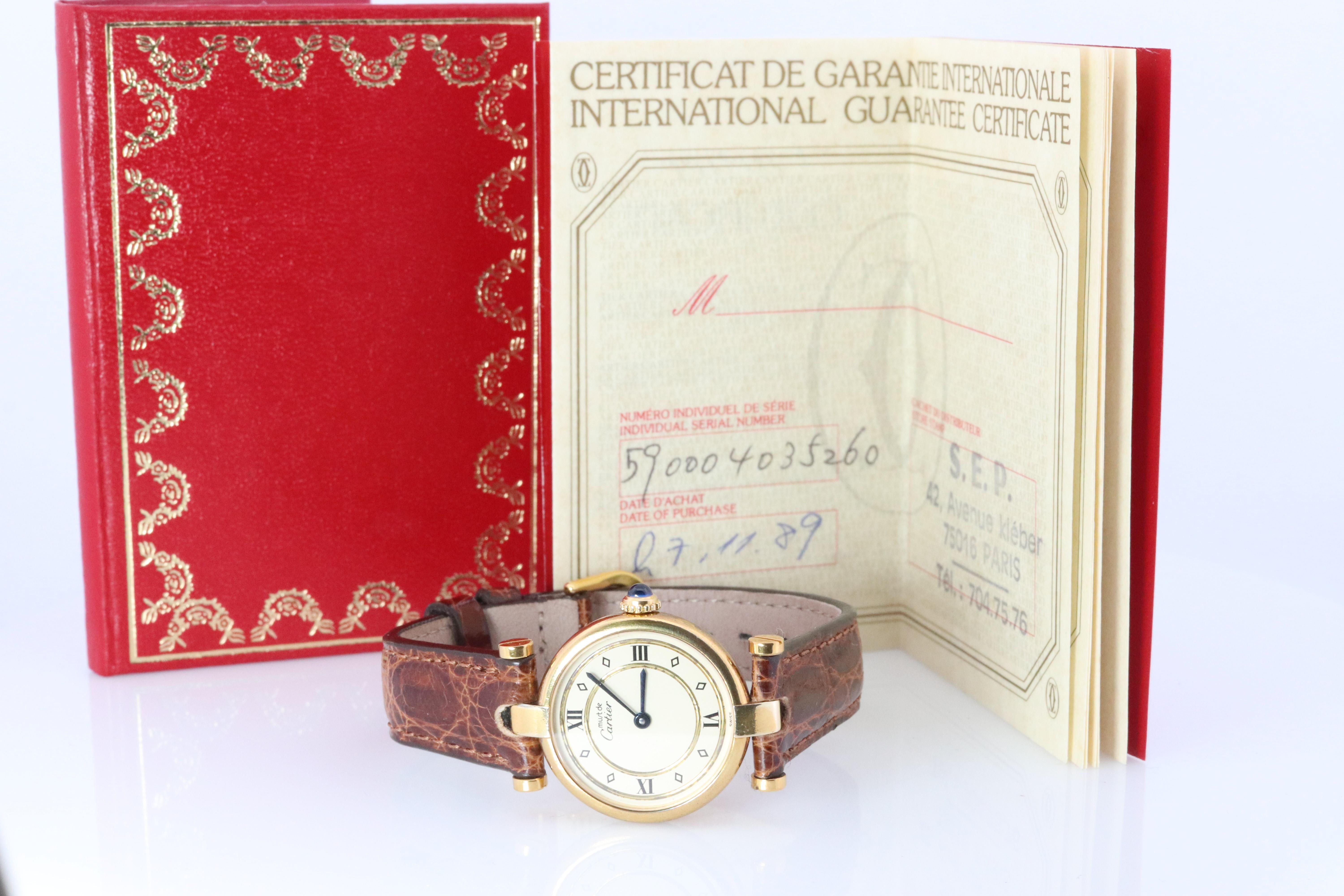 Genuine Cartier watch.

Original Paperwork from Cartier.

Vintage Must de Cartier Vendome

Rare Cream Gold dial.

Sapphire Cabochon Crown.

New Leather Band.

Condition: Wear consistent with age. New battery installed.

Details:
24mm Round case