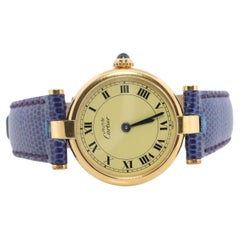 Une véritable montre Cartier. Must de Cartier Vendome Round Argent Vermeil White Face