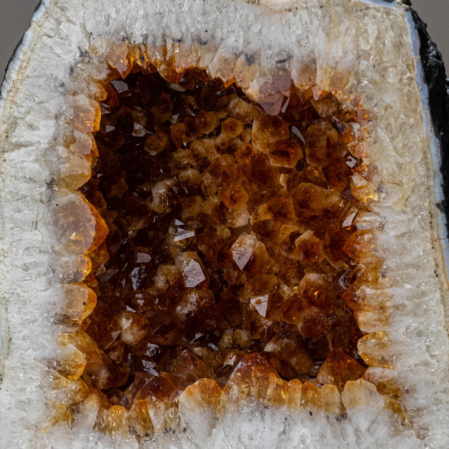 AAA museum quality, large Brazilian citrine geode lined with extra large lustrous, transparent to translucent, golden citrine quartz crystals. This beautiful specimen has vibrant orange/yellow color with highly reflective terminated faces.

Sunny