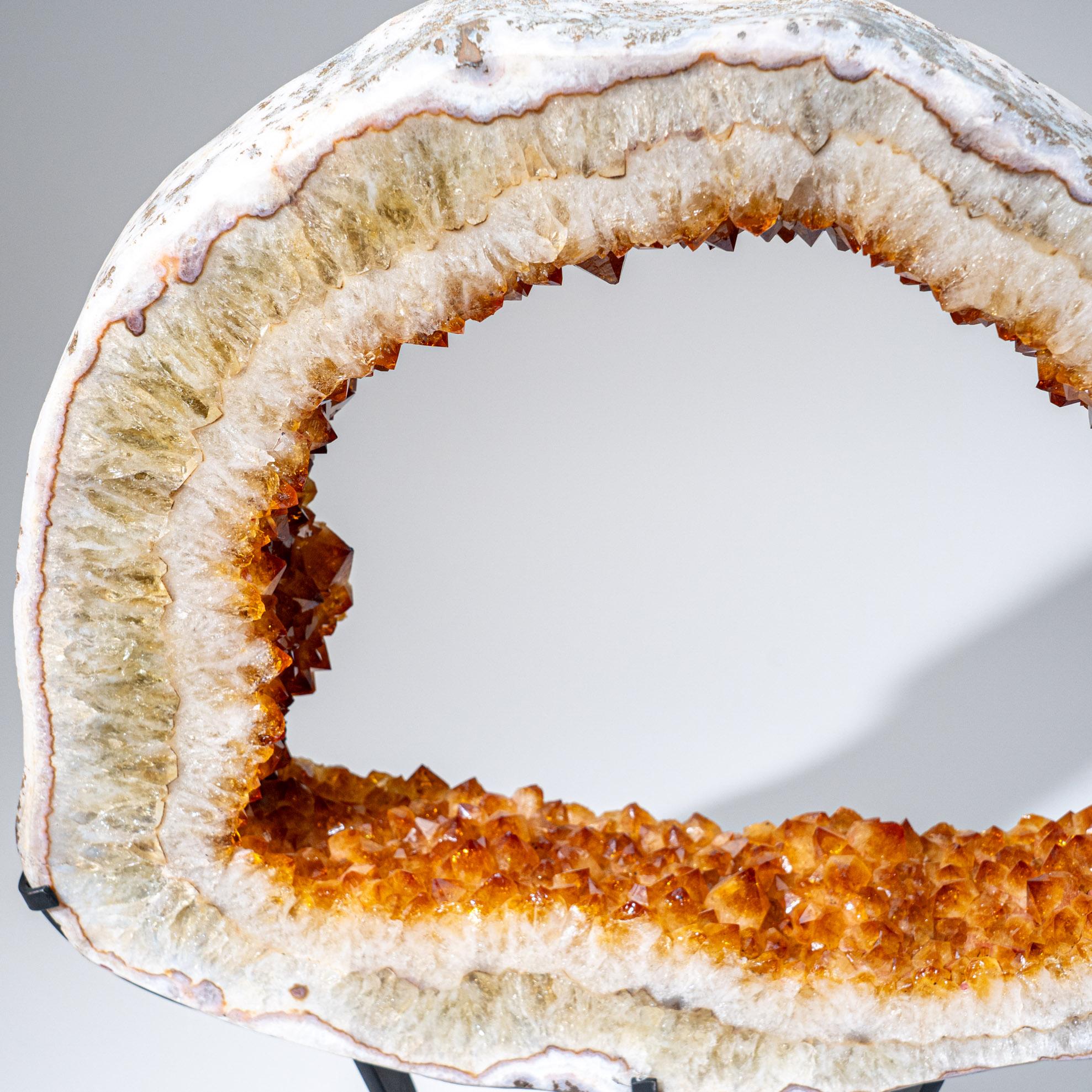 Precisely sliced cross-section of a Citrine geode from Brazil. This specimen showcases a full lining of radiant, golden quartz crystals and features vibrant orange and yellow hues with brilliantly shiny terminated faces. The entire slice is expertly