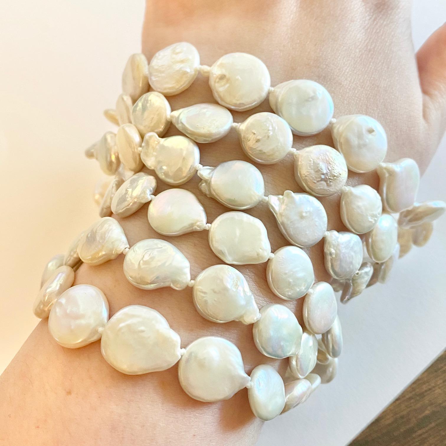 This necklace is a classic!! Pearls are always in style and represent tons of class and style and these cultured pearls have incredible luster! These are genuine coin pearls that have a gorgeous cool toned off white hue to them. These pearls have a