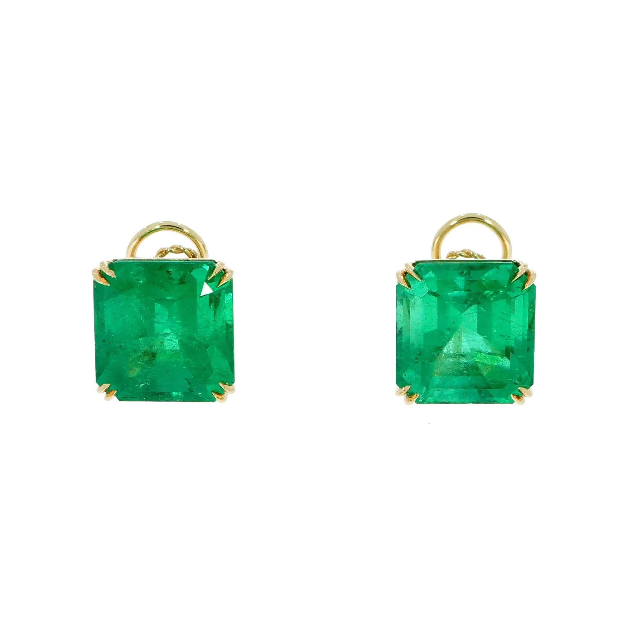 Elegant Stud Earrings Natural Medium Green Colombian Emerald Squared Emerald Cut Total Weight 44.13 carats. 
The earrings are crafted in 18 karat yellow gold and are secured with nice size omega clip style backs for comfort. 
The Emeralds weigh