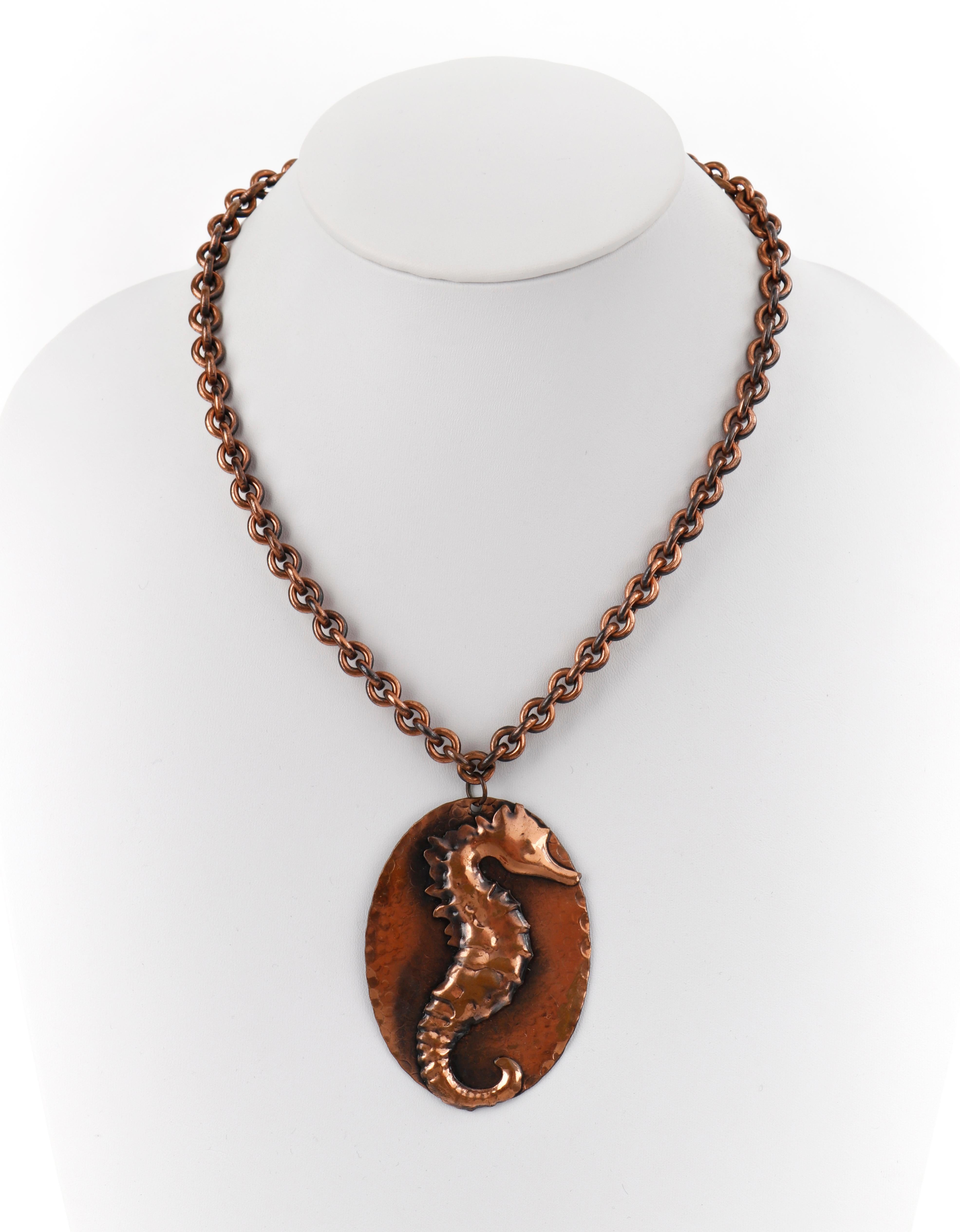Genuine Copper Handcrafted Seahorse Necklace Bracelet Earring Parure Set
 
Style: Pendant necklace; cuff bracelet; post back earrings
Color(s): Copper
Marked Material: “Genuine Copper” hallmark
Additional Details / Inclusions: Genuine copper 4 piece