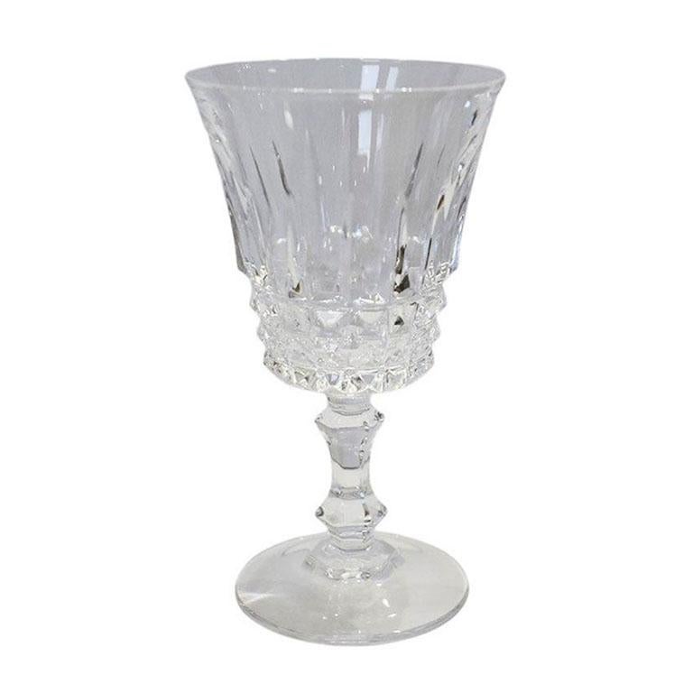 A set of five genuine cut lead crystal stemmed glasses. This set is from the 1980s and made in France. They are in the Tuileries no 7 pattern. Each glass features a cut crystal geometric pattern along the body of the glass. The glasses are mini-size