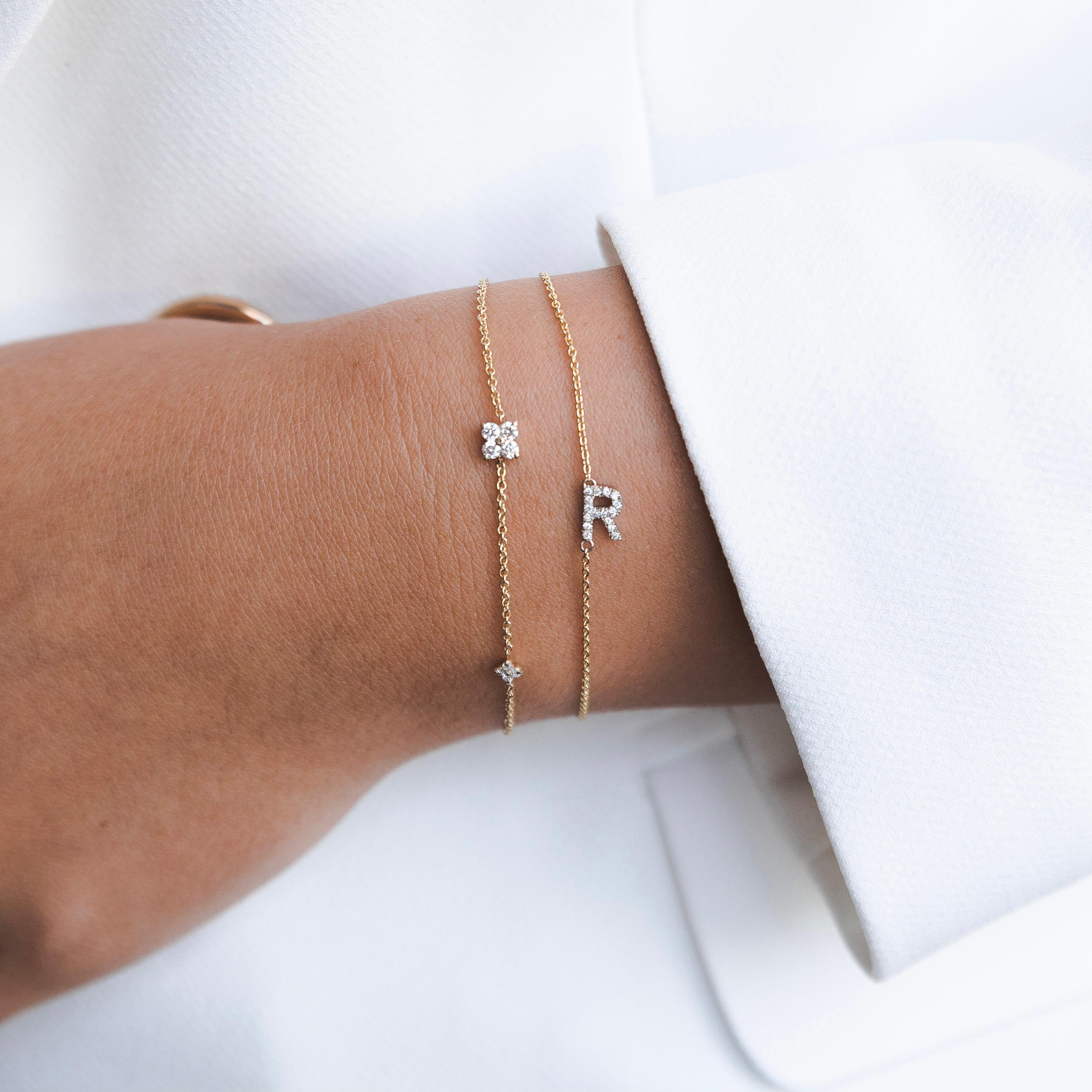Personalized Genuine Diamond Asymmetrical Letter Bracelet in 14k Yellow Gold, Shlomit Rogel

Make it personal!
Beautifully handcrafted in 14k yellow gold, this chain bracelet features an asymmetrical initial of your choice embellished with genuine