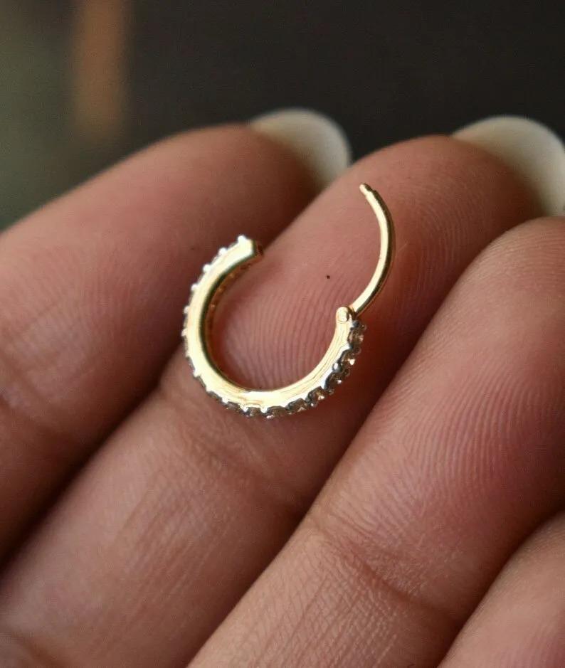Genuine Diamond Clicker Ring For Nose 14k Gold Nose Cartilage Conch Helix Hoop.

Material
14k Yellow Gold
Metal
YellowGold
Secondary Stone
Diamond
Closure Style
Clicker
Size
7mm to 13 mm
Color
White
Main Stone
Diamond
Gauge (Thickness)
16g (1.2