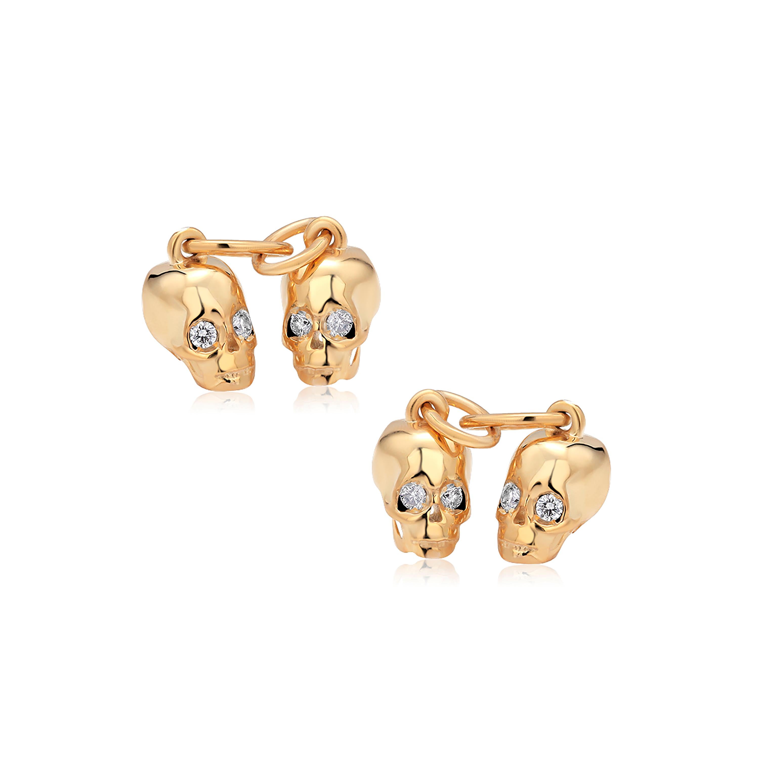 Sterling Silver double-sided cufflinks 
Four skull-shaped charms
Cufflinks measuring one inch
Four round genuine natural diamonds weighing 0.15 carats
New cufflinks
Yellow gold plated 
