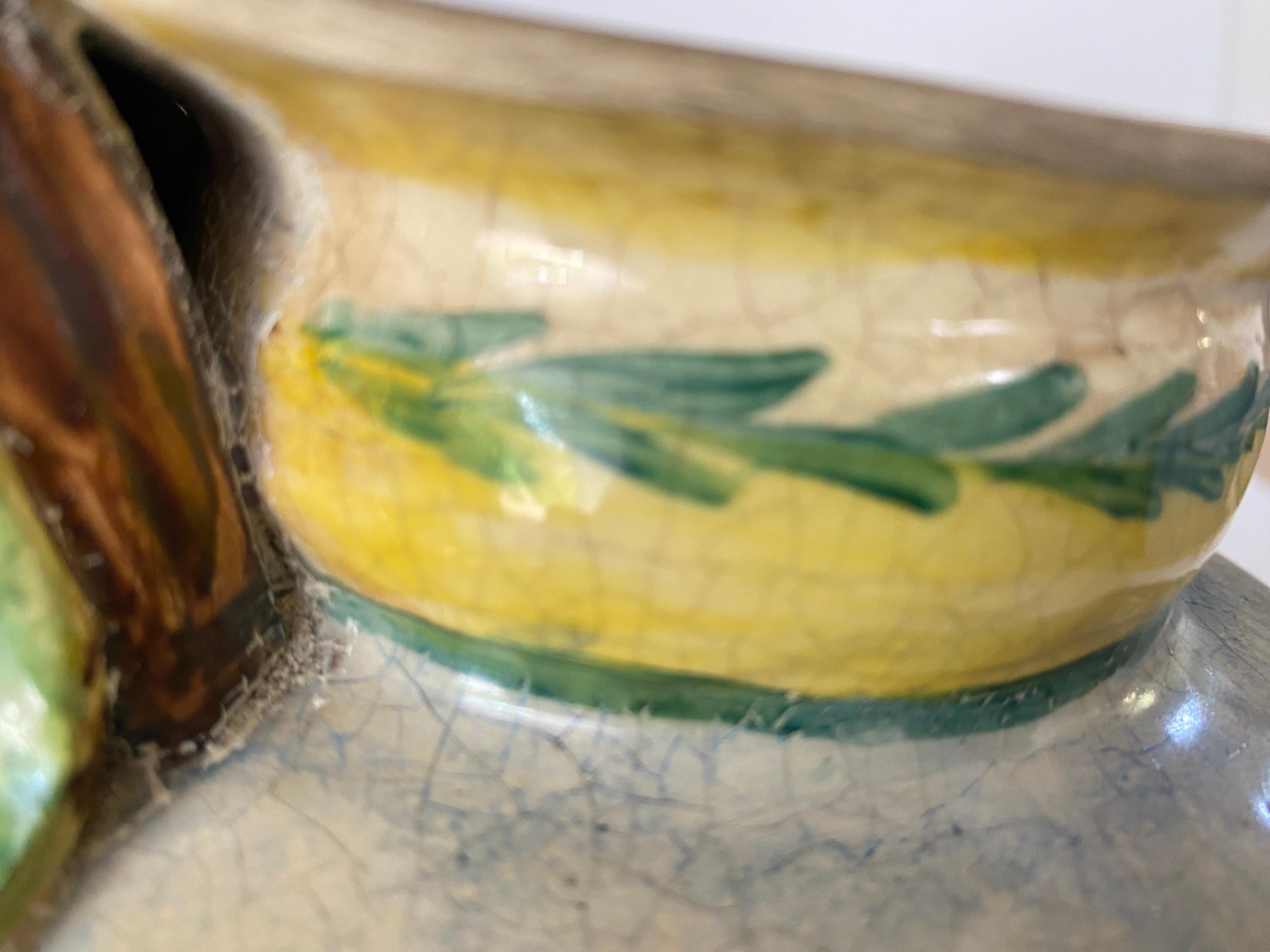 Vase in Faience, in a Green red and yellow color. With a beautiful Glaze. It has been made in France in 1757 in Lille.
It is signed Lille 1757.
The decor is painted in the style of Tenier.