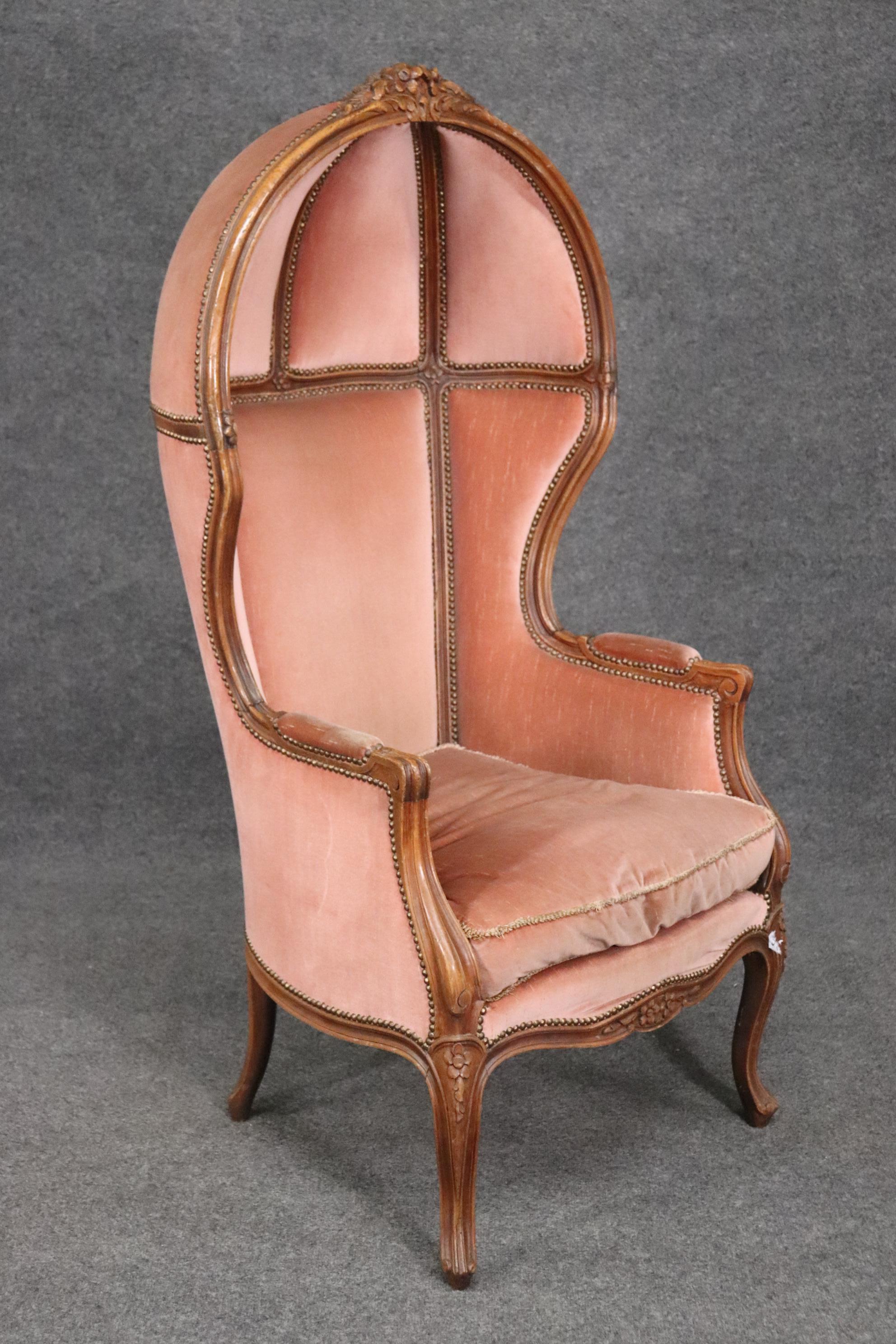 This is a fantastic carved walnut French porter chair. The carving is masterfully done. The upholstery is in good usable condition. The chair is also comfortbale. The chair measures 27 deep x 30 wide x 55 tall and the seat height is 19 inches. Dates