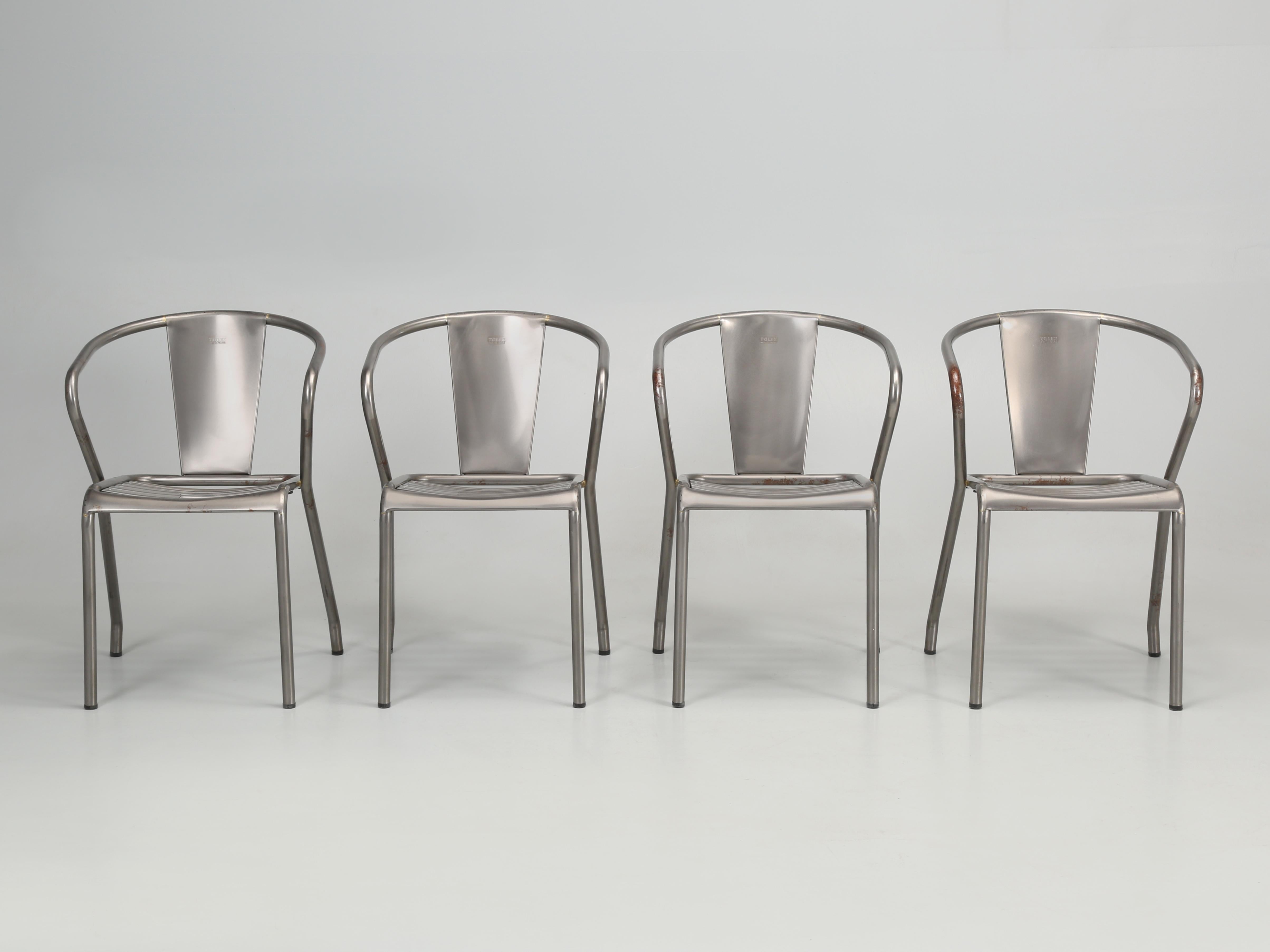 Set of (4) French Genuine tolix steel stacking chairs that have been powder-coated by Tolix. Please not the brown treading that is visible under the powder-coating and we have noticed this cosmetic flaw on hundreds of Tolix Chairs. 
This is the