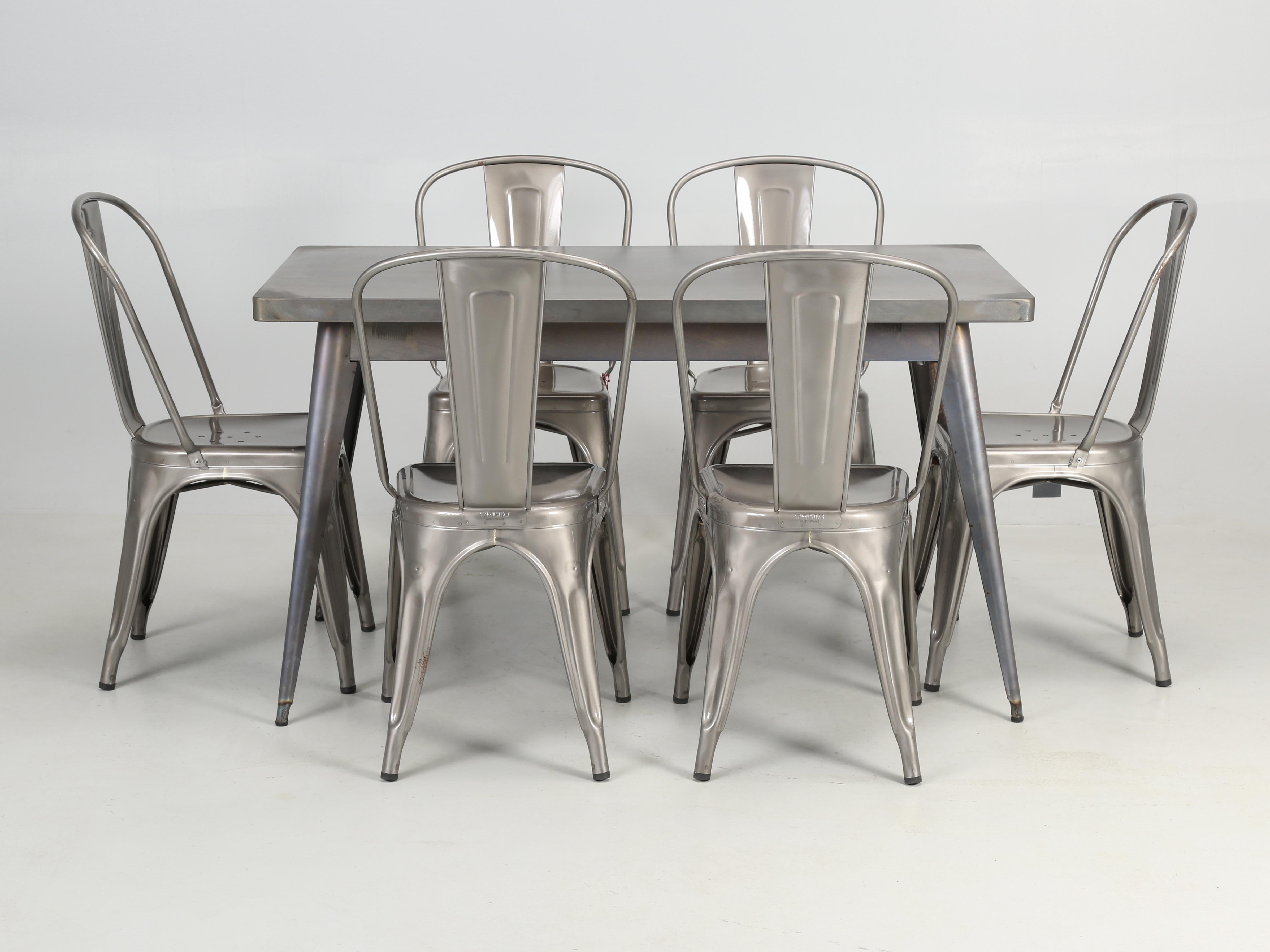 Original French T55 Tolix Rectangular Dining Table – 51.2” x 27.5” (130cm 70cm) with matching set of (6) Tolix steel stacking chairs. Our Tolix indoor-outdoor dining table is made from raw steel with no protective coating and has been sitting in a