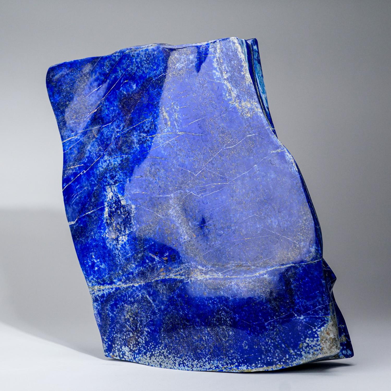 Beautiful hand-polished free form of AAA quality natural Afghani lapis lazuli. This specimen has rich, electric-royal blue color enriched with scintillating pyrite micro-crystals.

Lapis Lazuli is a powerful crystal for activating the higher mind