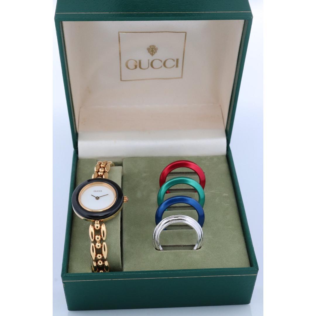 Vintage from the 1990s
Band material: Leather, Silver
Materials: Silver
Power: Battery

Readout: Analog

Genuine Gucci Watch.

11/12.2 Reference number.

Gold Tone with interchangeable bezels.

Condition: New battery. Comes with original box and