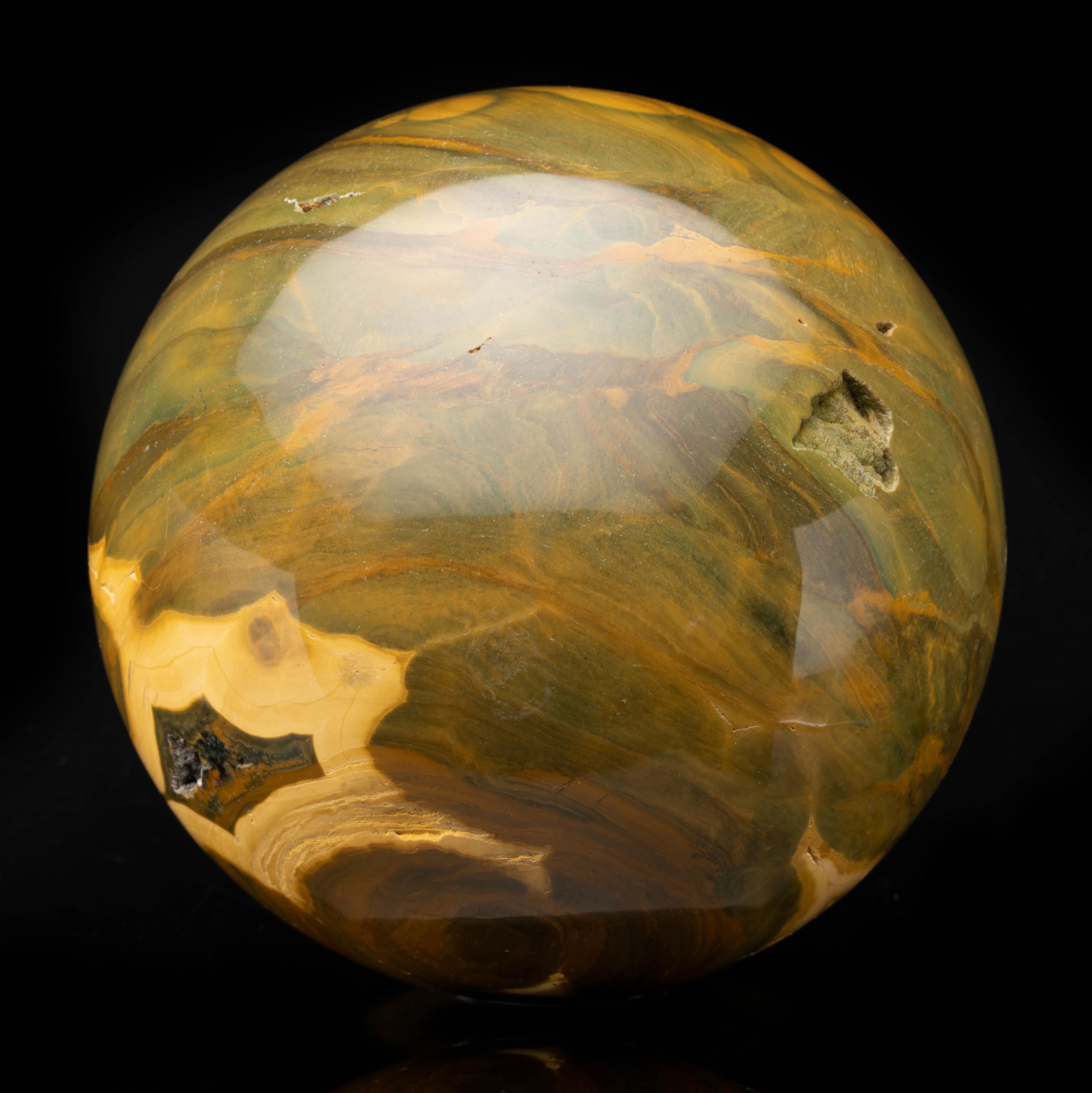 This rare variety of Jasper is known for small, orb-like markings and often boasts vivid natural patterns in a rainbow of colors. This 3.96-pound piece from Madagascar where much of this species is sourced boasts exceptionally large and symmetrical