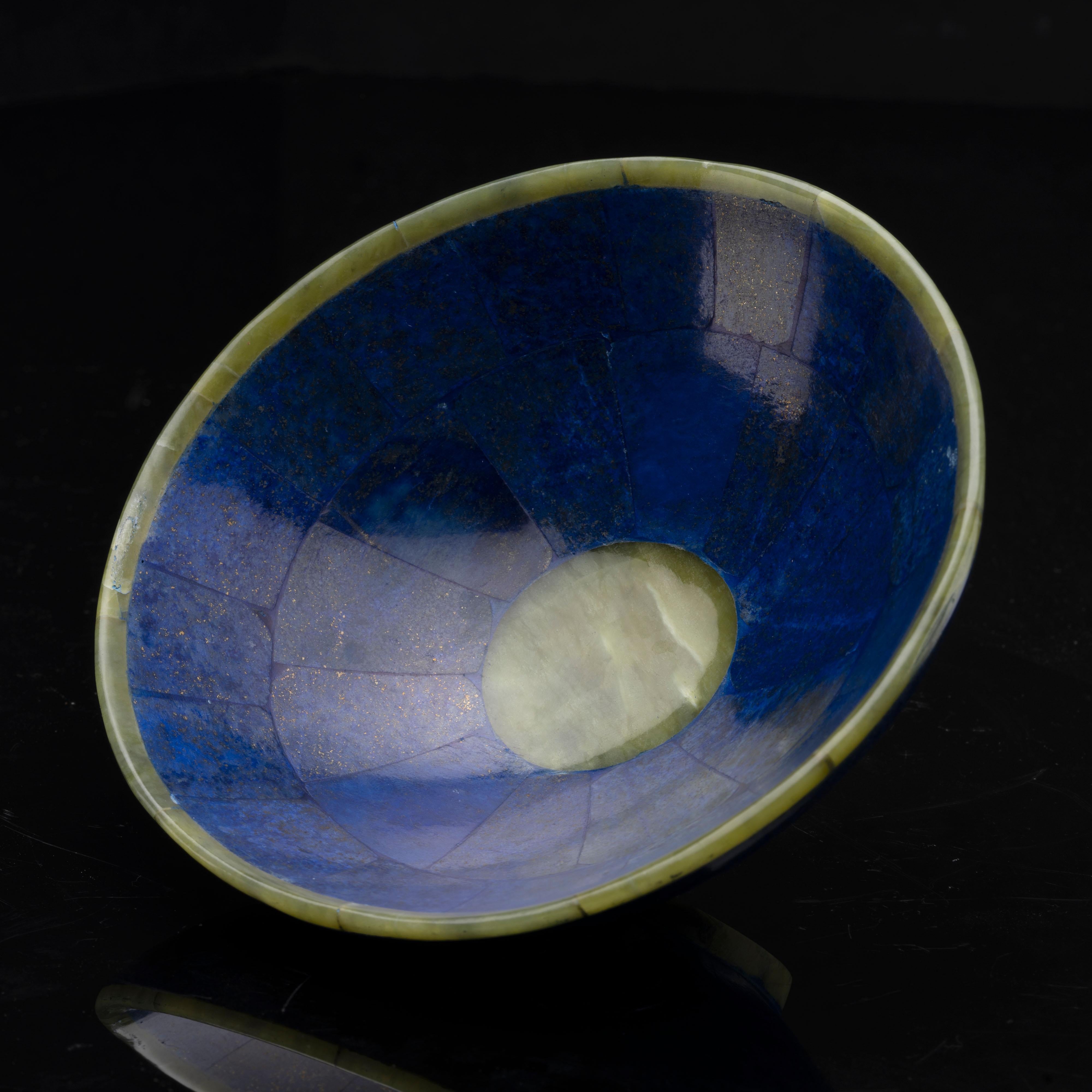 This standout home décor piece made from genuine high quality lapis lazuli and excellent quality green jade has been hand-cut, hand-assembled, and hand-polished into a beautiful bowl. This handcrafted approximately 260 gram specimen displays a