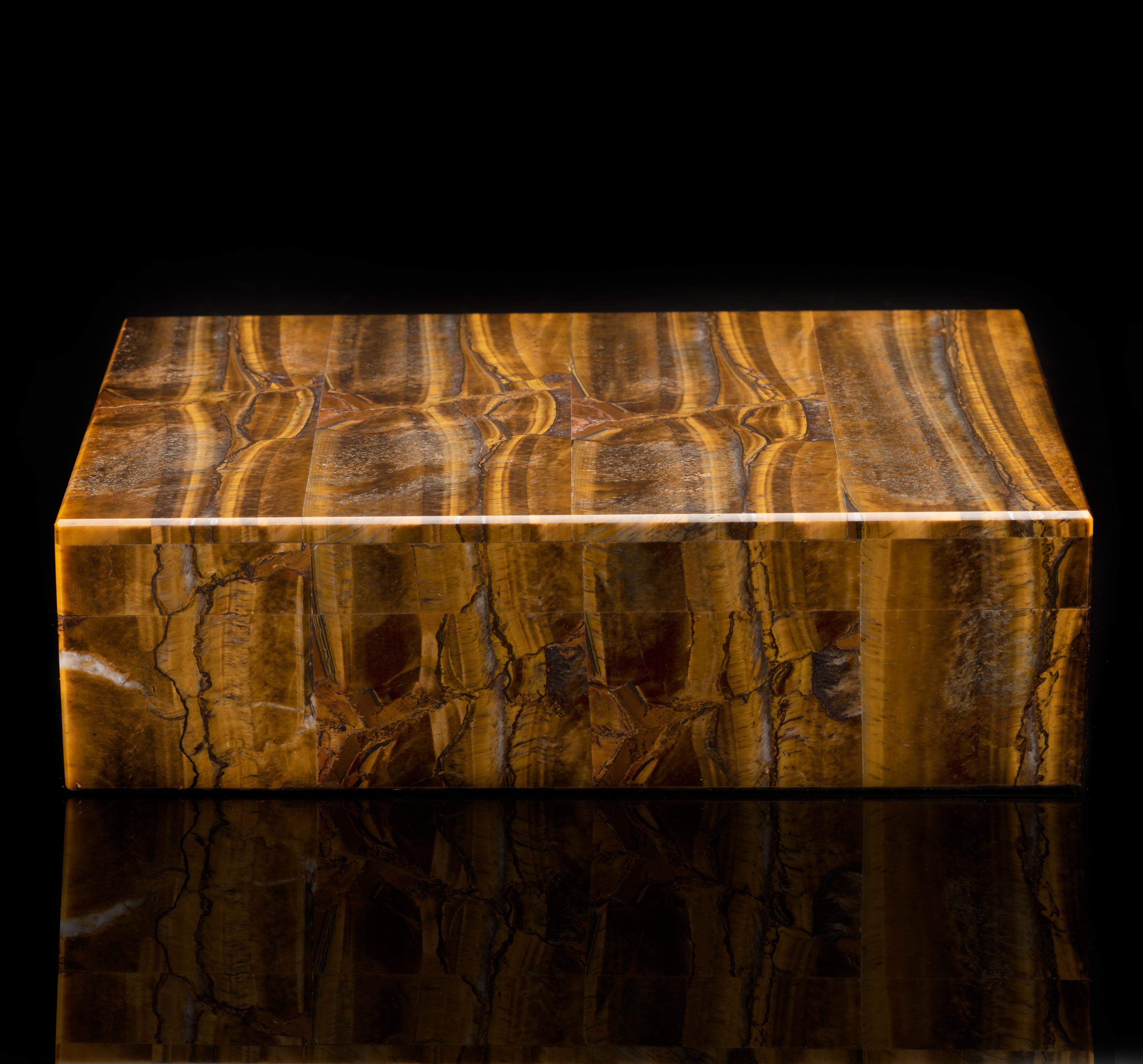 This seamlessly handcrafted box with hinged lid and brass hardware has been hand-carved and carefully hand-assembled in Italy out of the highest quality tiger's eye in gorgeous rich brown and caramel hues with incredible chatoyance. Weighing over