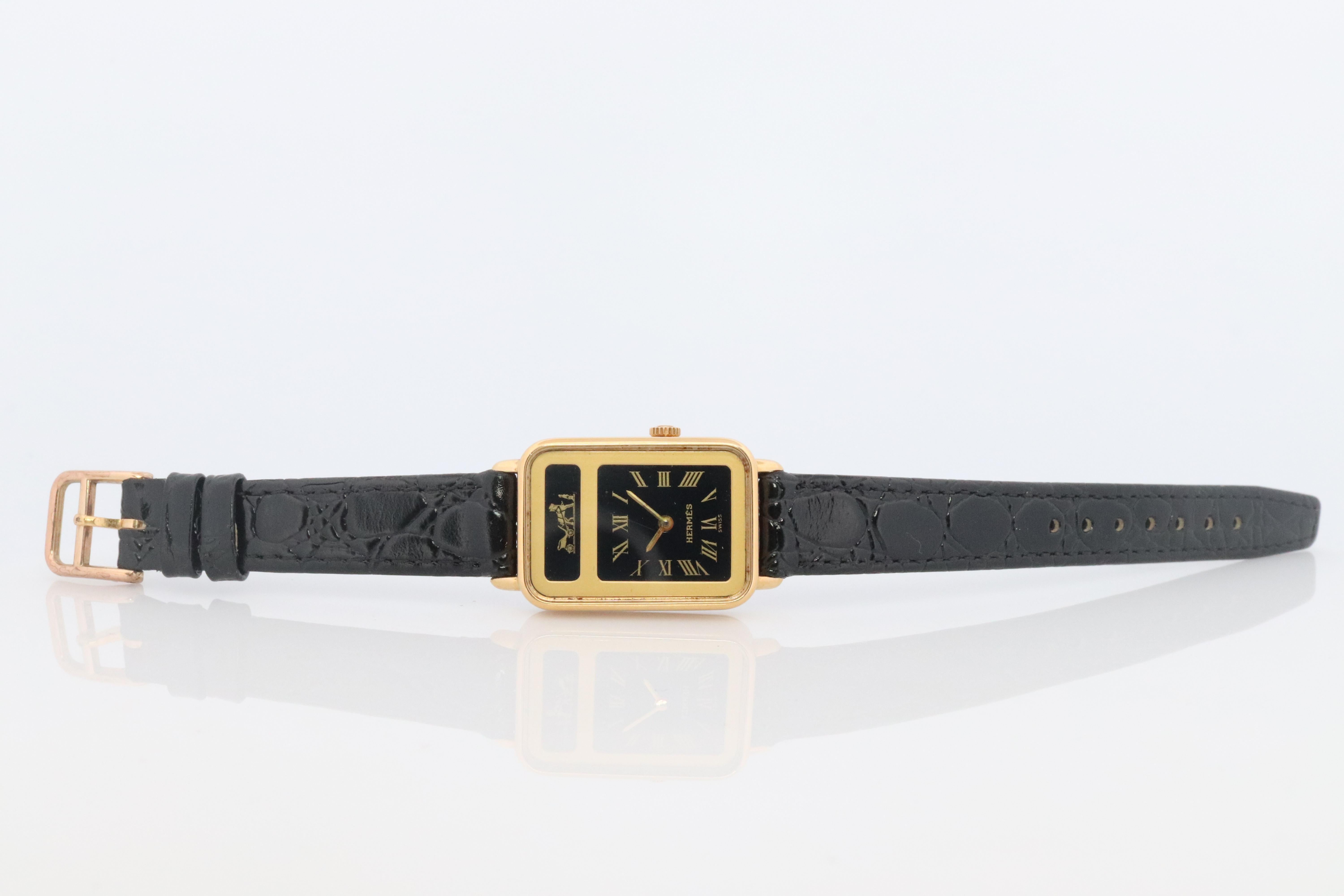 This is an authentic HERMES Stainless Steel and Gold plated Watch.

Extremely Rare.

Quartz movement with 6 jewels. New Battery installed.

Condition:
NEW battery installed. 

Details:
20mm by 28mm Case
New Gucci Leather Band.
Genuine Hermes Buckle