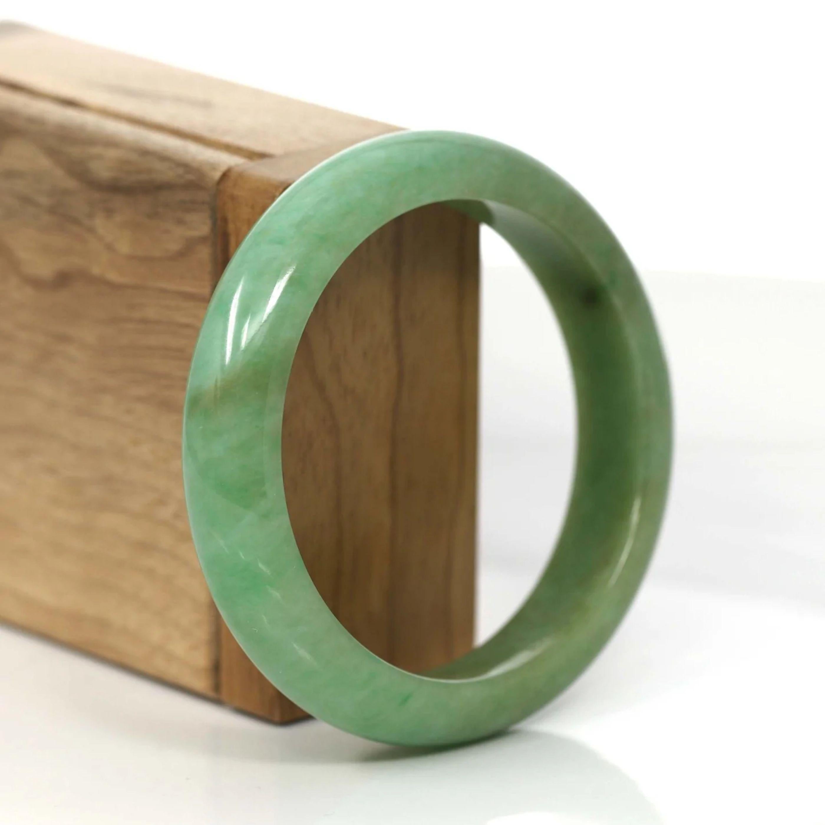 * * DETAILS--- This bangle is made with Burmese yellow-green jadeite jade. This bangle is made with very fine texture from old mine. The jade texture is very smooth, with part of the green color and yellowish.  It's a very unique bangle with a
