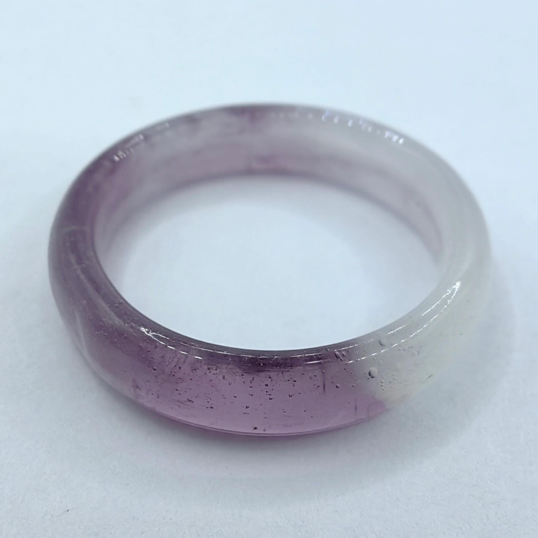 Introducing our Genuine Icy Lavender Serpentine Jade Ring, a mesmerizing piece that celebrates the unique beauty and metaphysical properties of Serpentine Jade. Crafted entirely from this exceptional gemstone, this ring showcases a harmonious blend