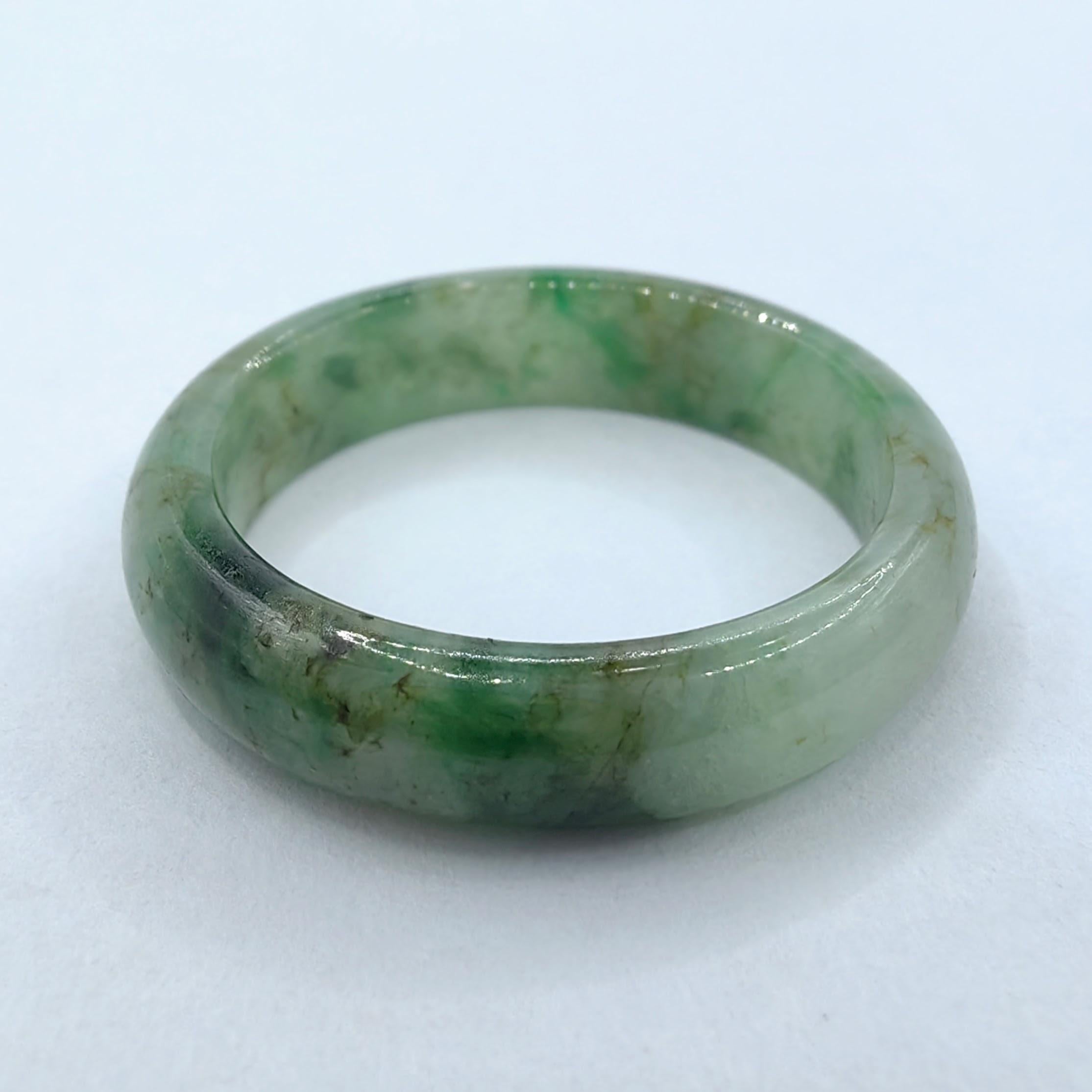Introducing our Genuine Icy Olive Green Serpentine Jade Ring, a stunning piece that showcases the captivating beauty of this remarkable gemstone. Meticulously crafted with precision, this ring is a true testament to elegance and the allure of