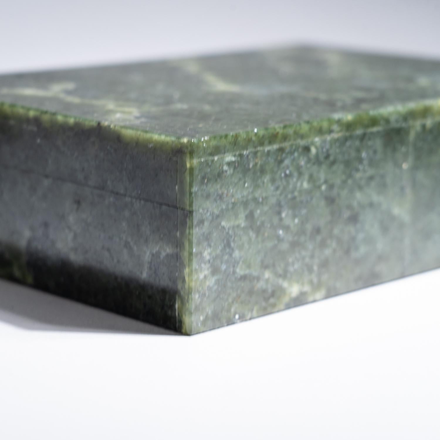 Large rectangle jewelry box handmade from the finest top grade natural jade, with rich golden color and stunning chatoyancy banding. The box has been hand polished to a mirror finish. The lid has a piano hinge opening to reveal a black velvet lined