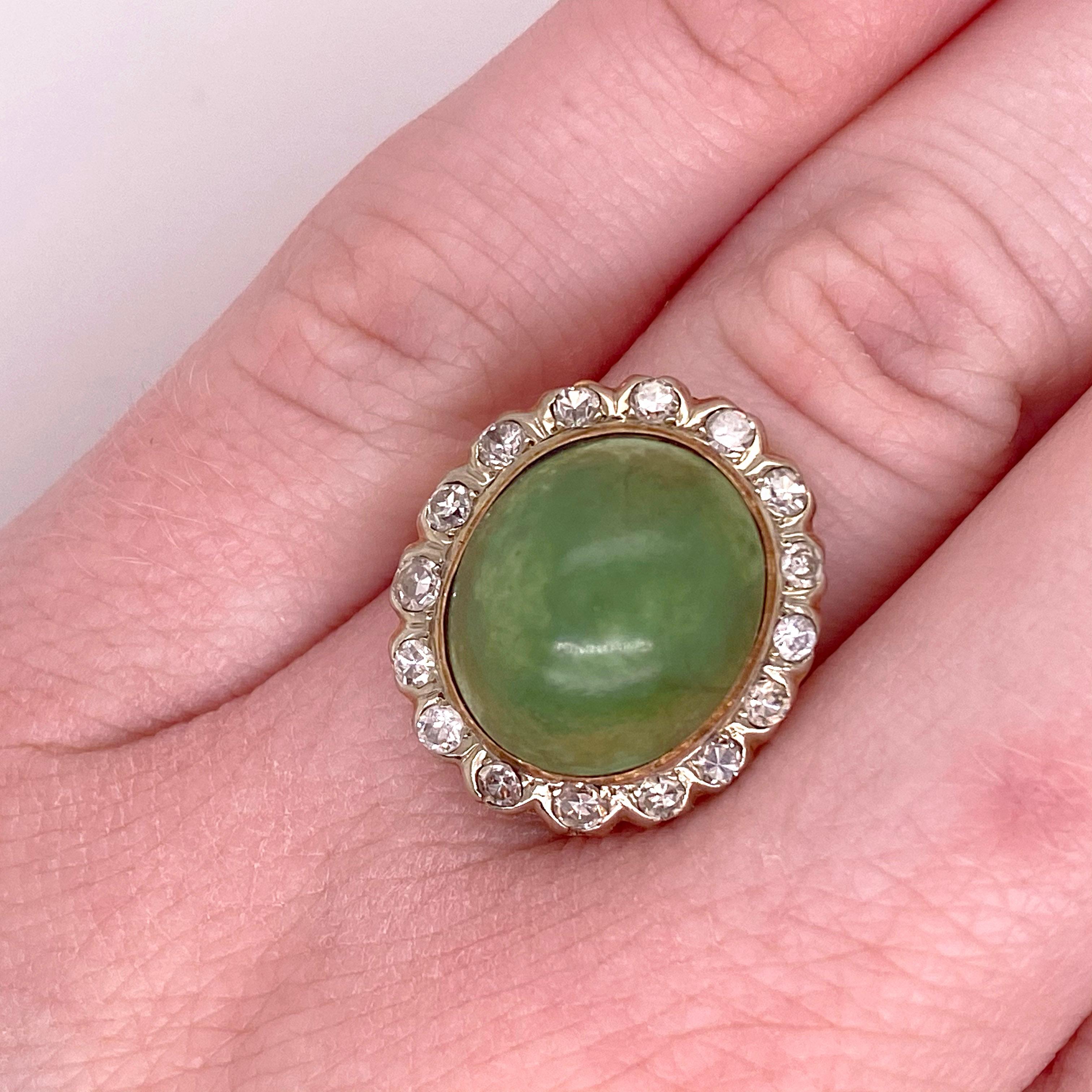This estate jadeite jade ring is made with true quality of the 1950s Circa 1950.  The oval jade has an oval halo of diamonds around it.   The ring is in excellent shape and is sizable!
14K Yellow Gold
Gemstone Carat Weight-13.65 Carats Total
