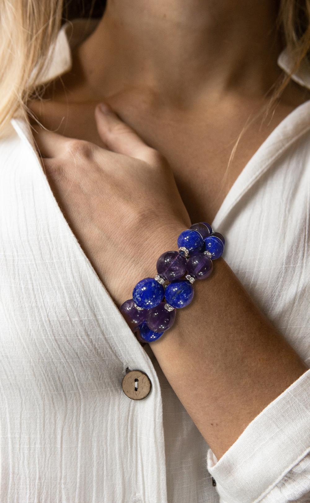 Genuine Lapis Lazuli and Amethyst Diamanté Sterling Bead Adjustable Bracelet

Unusual real blue lapis-lazuli and purple amethyst 16mm beads interspersed with crystal set rondels attached to an adjustable sterling silver clasp measure a generous