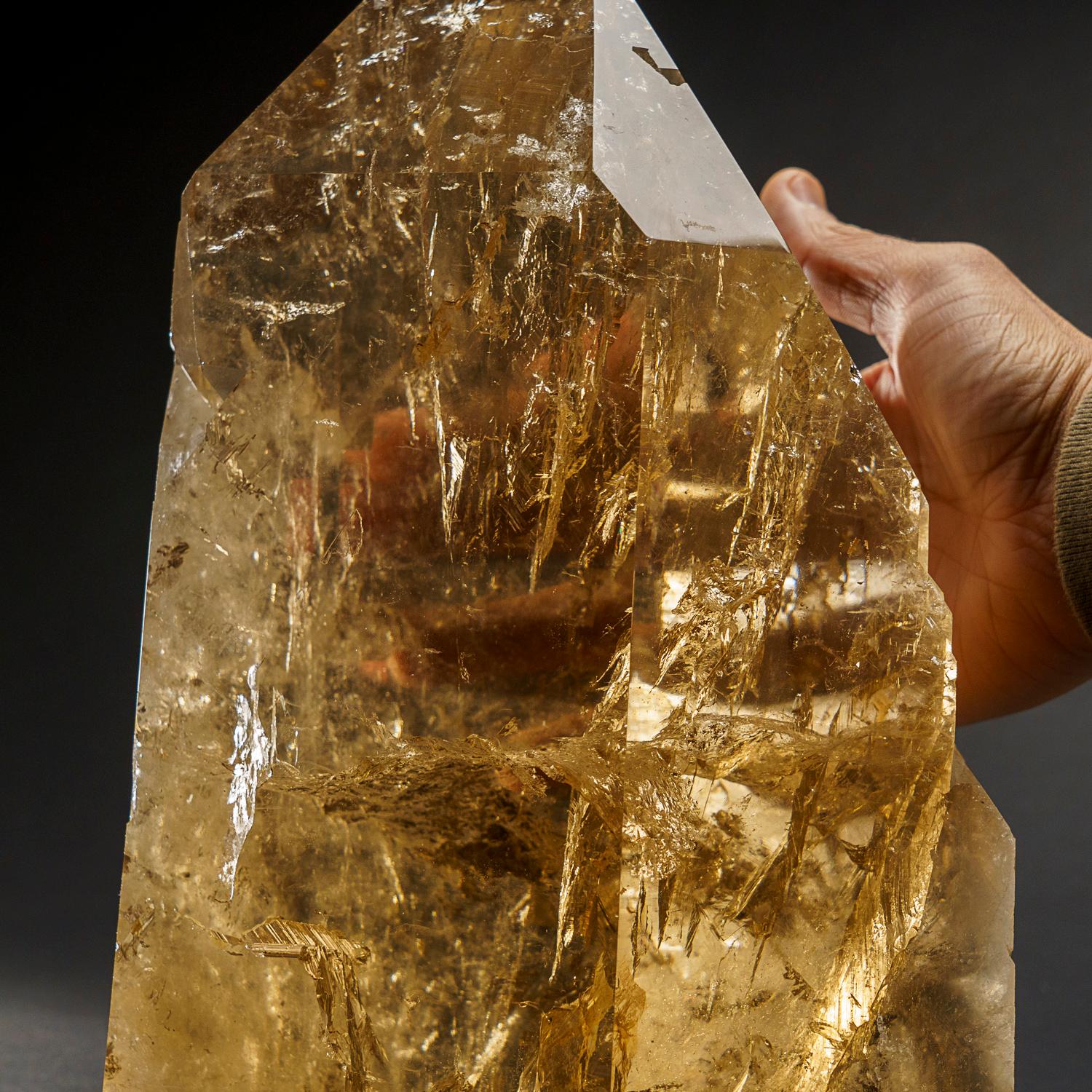  This exceptional Cathedral Smoky Quartz crystal point from Brazil, weighing in at 29 lbs, boasts museum-quality perfection with a flawlessly terminated face. Its remarkable luster and natural lightbrary smoky yellow color make it a world-renowned