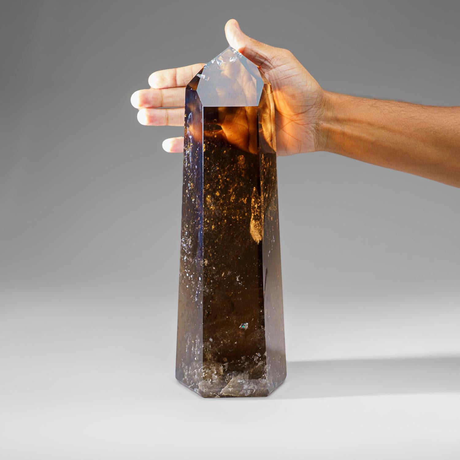 Museum-quality, large crystal of transparent Smoky Quartz point with perfectly terminated face. This world-class crystal point is internally flawless, with top luster and excellent natural smoky yellow color.


Smokey Quartz works with all of the