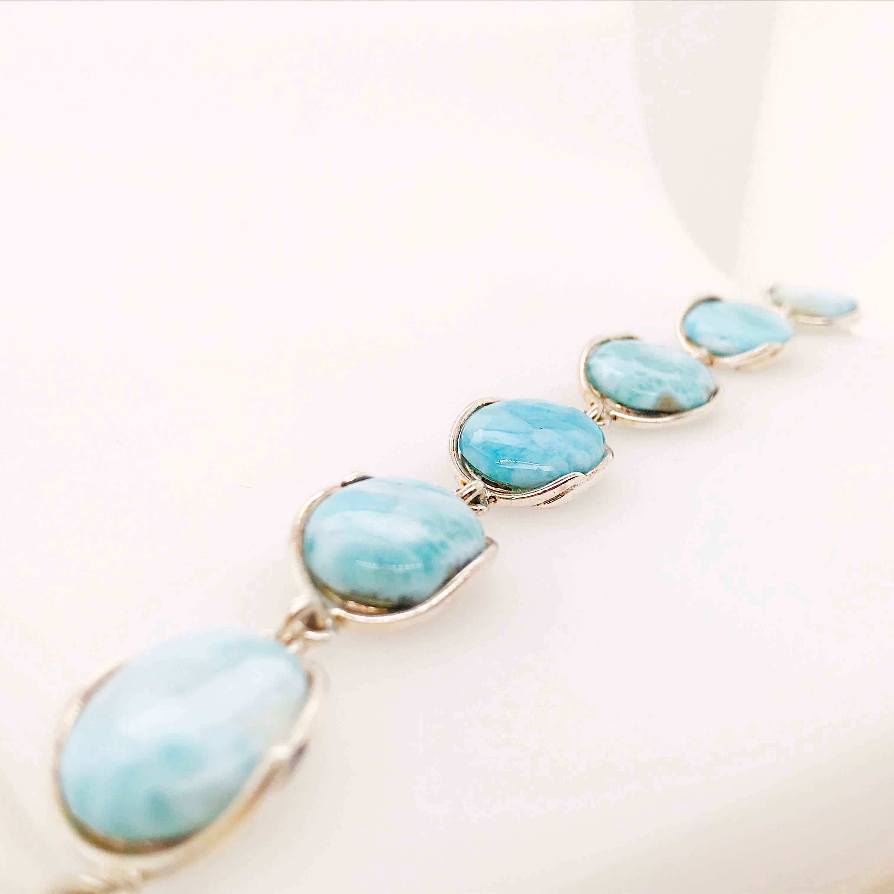 The precious genuine Larimar gemstone bracelet is a statement piece. Made with genuine Larimar gemstone pieces that have been hand polished and show the Larimar's true ocean blue colors and unique color spread. Larimar is a healing stone that