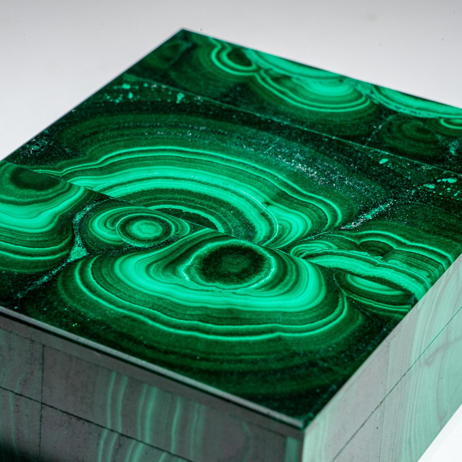 Beautiful rectangle jewelry box handmade from the finest top grade natural bulls eye Malachite from Congo, with rich translucent to transparent green color. The box has been hand polished to a mirror finish. The lid has a piano hinge opening to