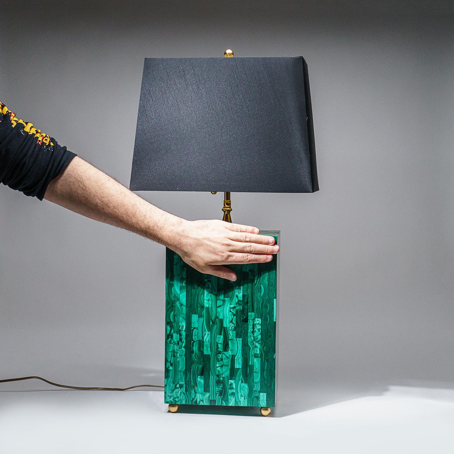 Handcrafted to perfection, this lamp was made from AAA quality natural Malachite. this rectangular polished lamp makes a beautiful display with its high quality craftsmanship. The black fabric lampshade is included in this piece. Its round metal
