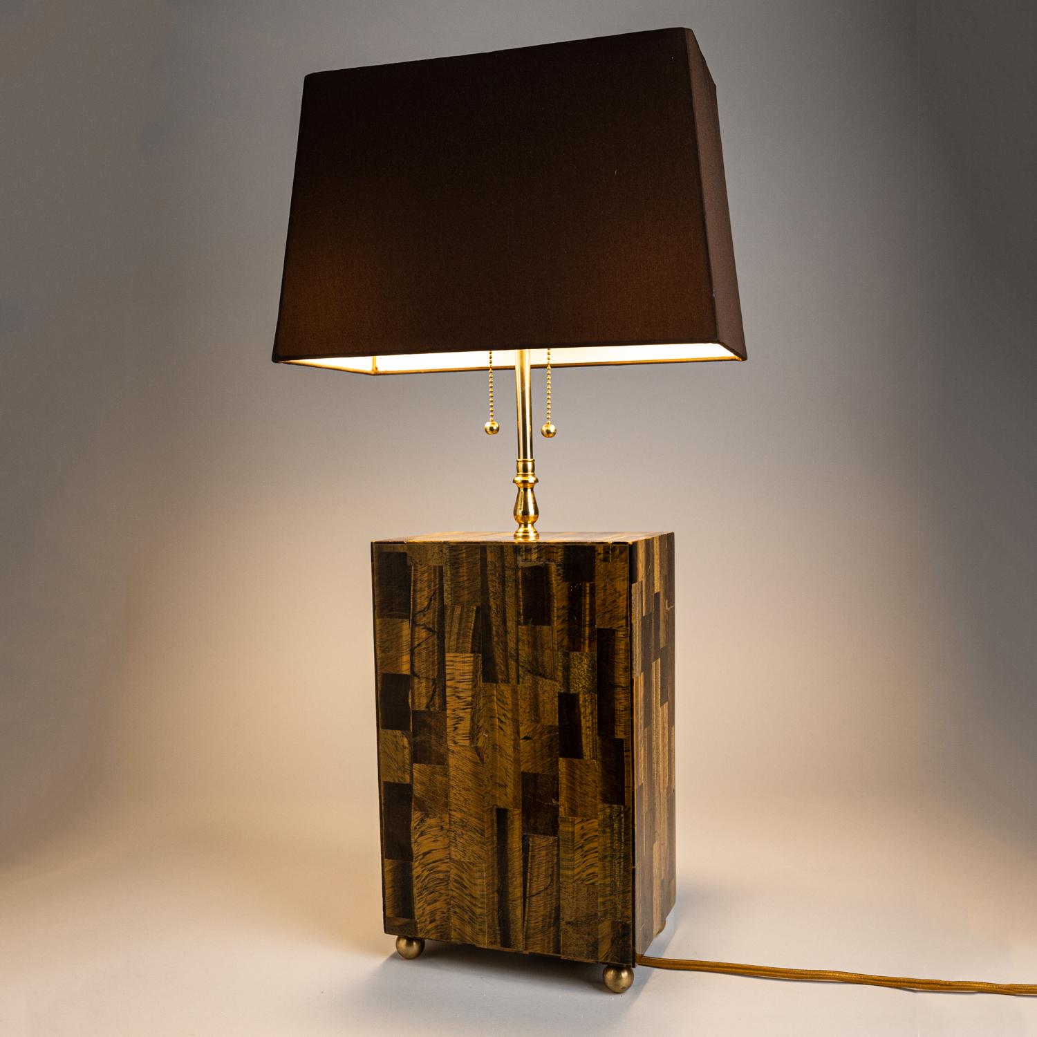 Genuine and Beautiful Mosaic Tiger's Eye Floor Lamp from India
Crafted exclusively in golden tiger's eye, this rectangular lamp makes a beautiful display with its high quality craftmanship. The dark brown fabric lampshade is included in this piece.
