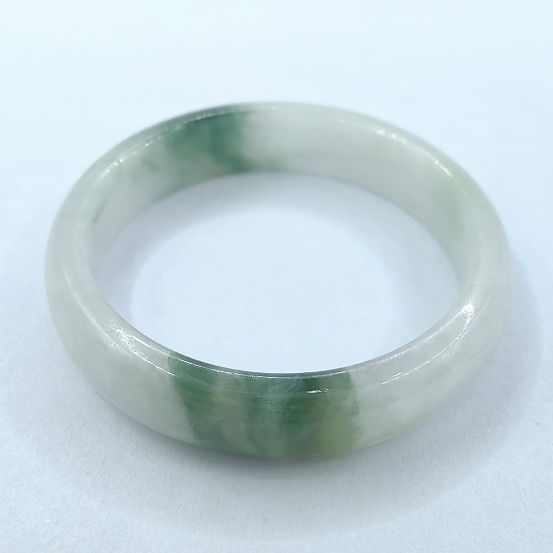 Introducing our Genuine Moss in Snow Serpentine Jade Ring, a captivating piece crafted entirely from genuine Serpentine Jade. This exquisite gemstone takes center stage, showcasing its mesmerizing beauty and natural allure. Meticulously crafted with