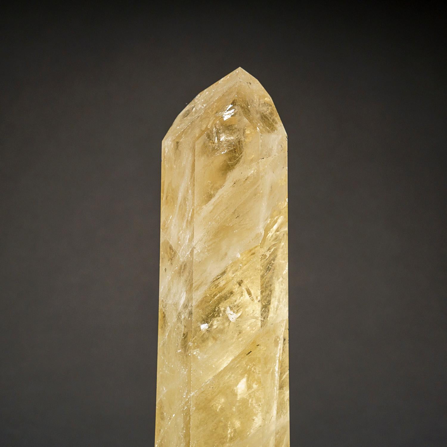 Museum-quality, large crystal of transparent Citrine quartz point with rutile inclusions. This world-class point is extremely large, with top luster and excellent natural smoky yellow color, internally this crystal is flawless.

Citrine can activate