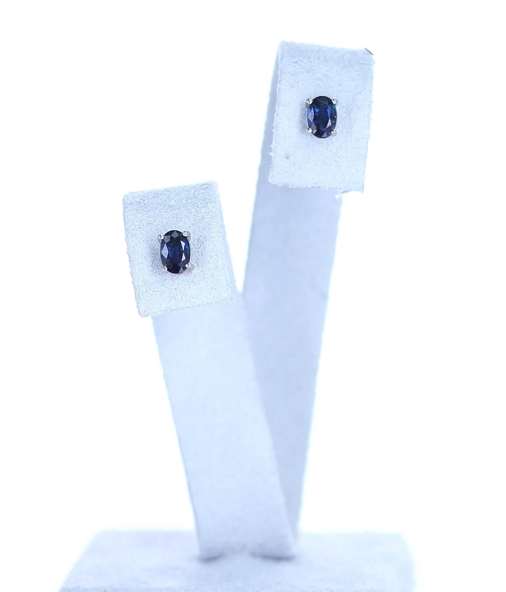A pair of Blue Sapphire Oval Stud Earrings in 18 Karat White Gold. The sapphires measure 6MM x 4MM. We can also customize the earrings according to your preferences, as per the size of the stone, type of stone, etc. Please contact us for more