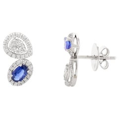 Boucles d'oreilles en or blanc 18 carats saphir bleu véritable et halo de diamants