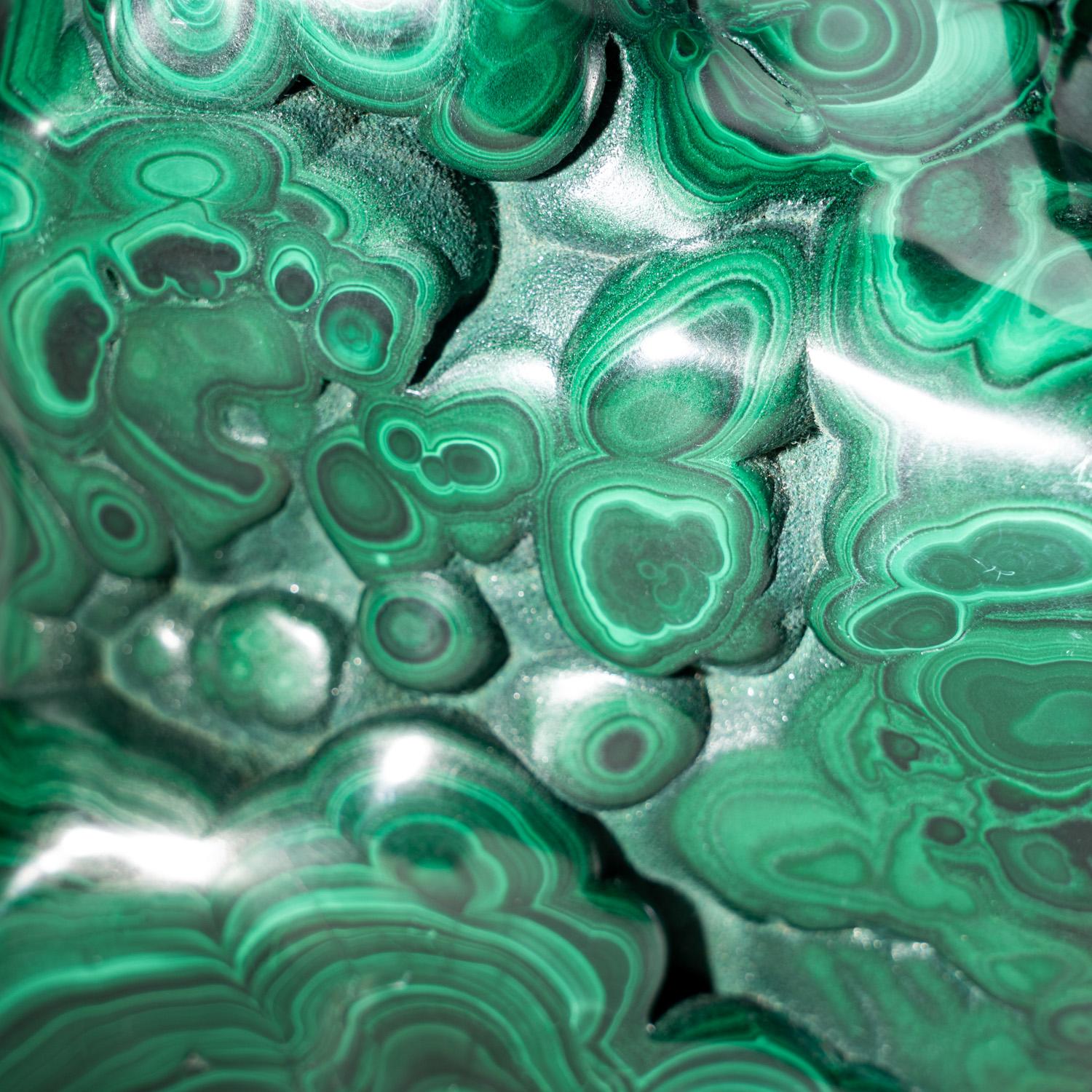 AAA-quality solid freeform of bulls eye Malachite from The Democratic Republic of Congo. This specimen has well defined banded concentric patterns. The piece is made of solid material with no fill whatsoever and is polished to a high-yield mirror