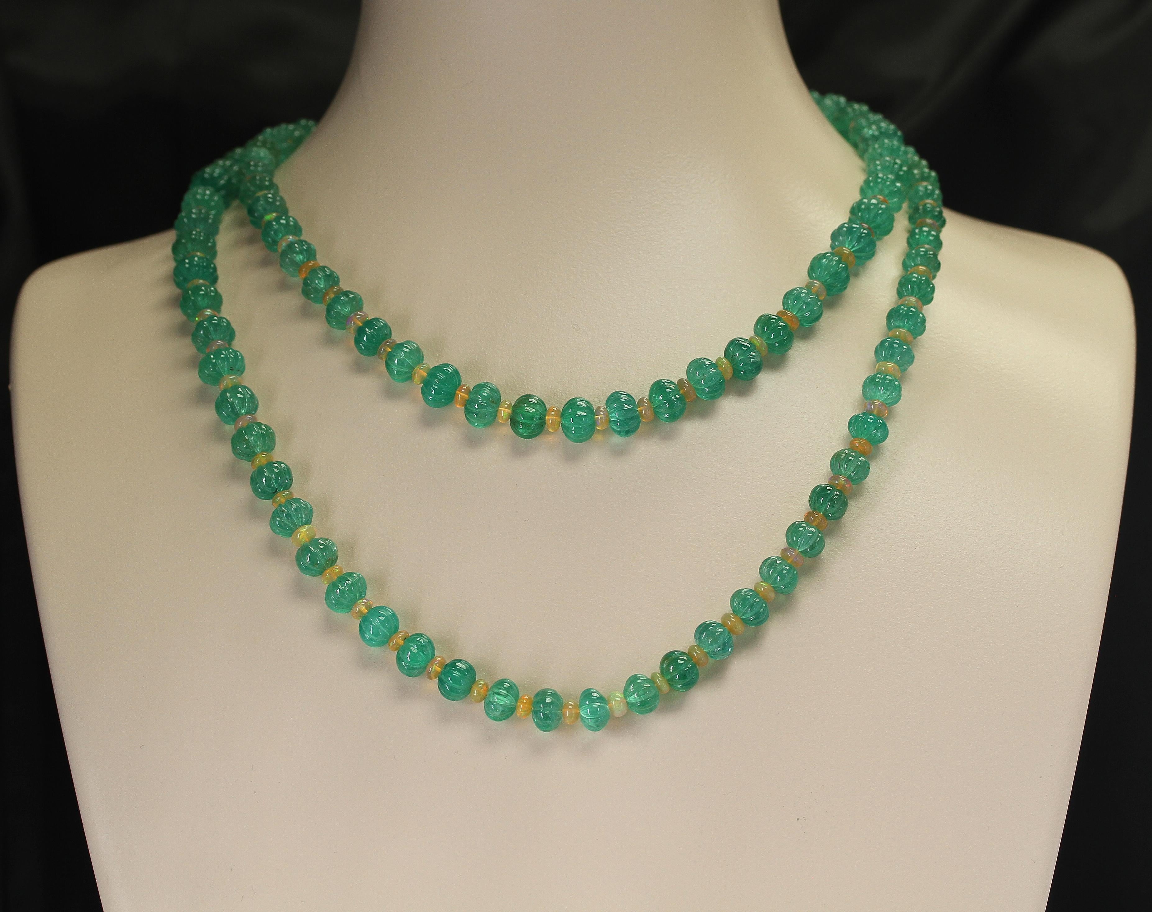 A Genuine & Natural Fine Necklace of Colombian Carved Emeralds and Opals. The Emeralds weigh 489 carats and the Opals weigh 44 carats. The total weight is 533.50 carats.  The length is 43