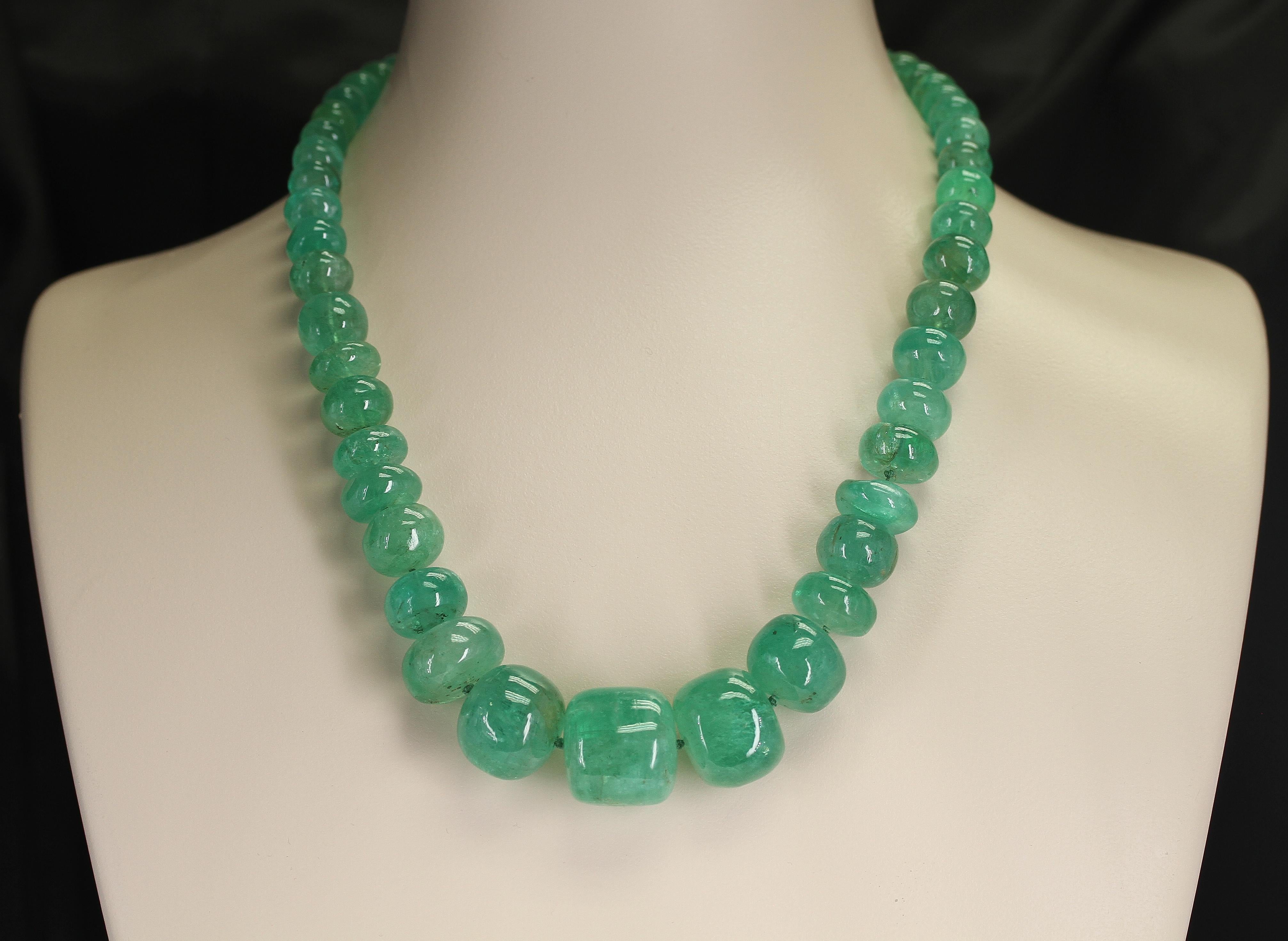 A magnificent Genuine & Natural Large Emerald Tumbled Beads Necklace with a Pearl Clasp. The beads range from 9MM to 22MM and the length is 22.5.
