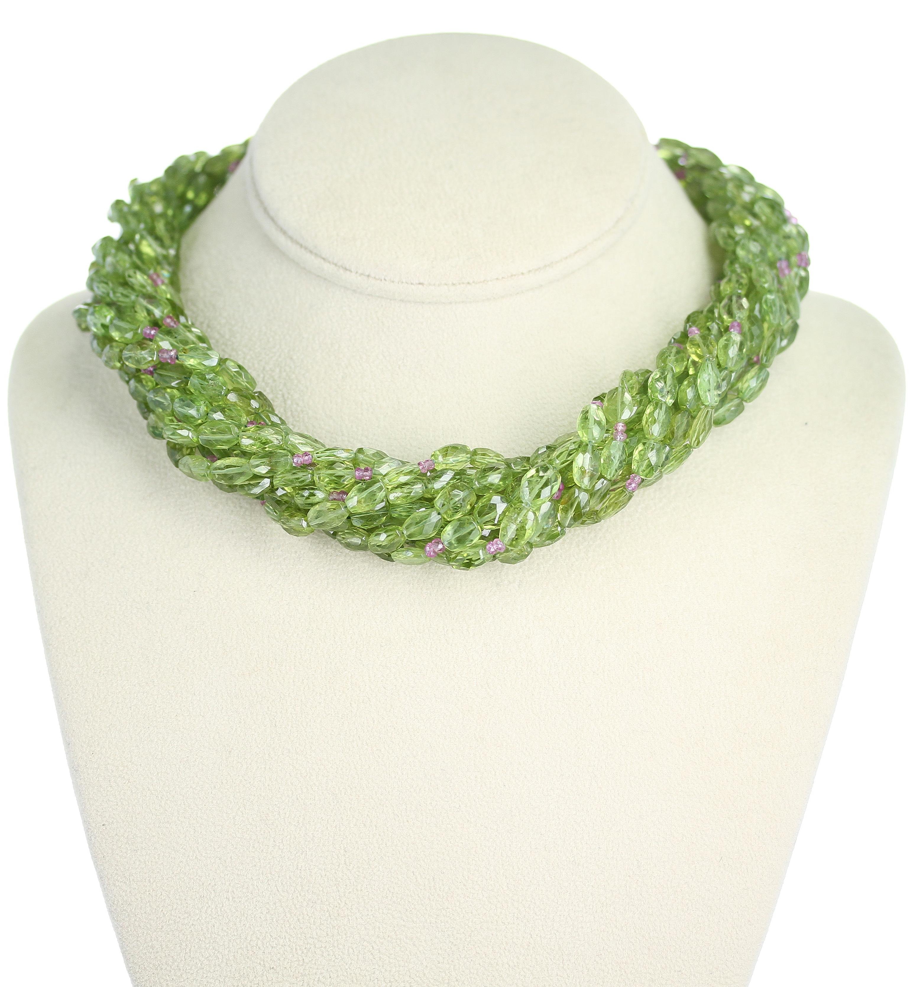 A Genuine & Natural Peridot Tumbled Faceted Beads with Pink Sapphire Beads Choker Necklace consisting of 10 lines weighing 972 carats. The clasp is 18 Karat Gold. The length is 17.25