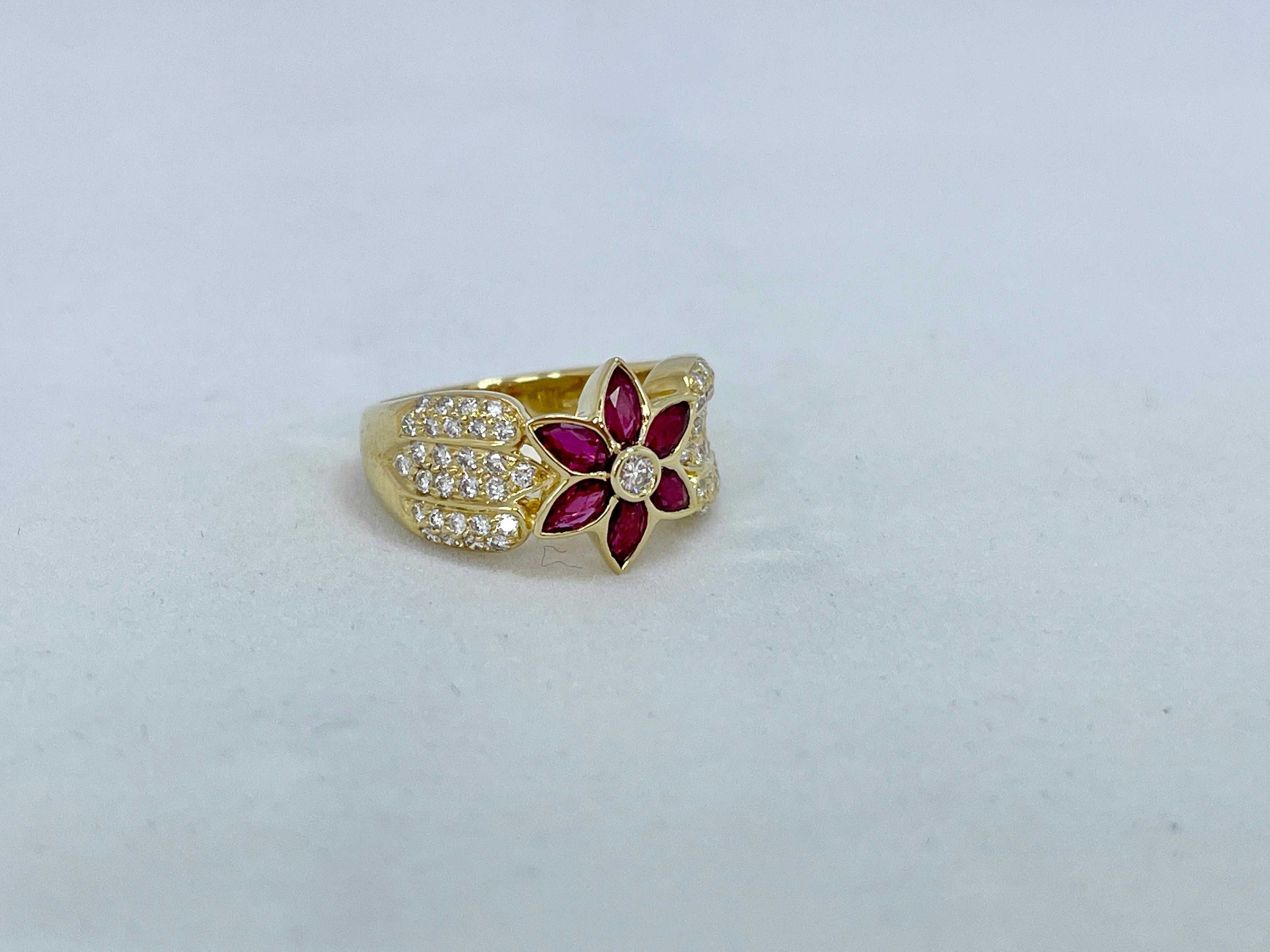 This flower ring is unique and so pretty!

It features 6 Natural Rubies that are Marquise cut and set in the shape of a flower.  Together they weigh just over 3/4 of a carat (.77ct) and this is stamped inside the ring.  They do not appear to be